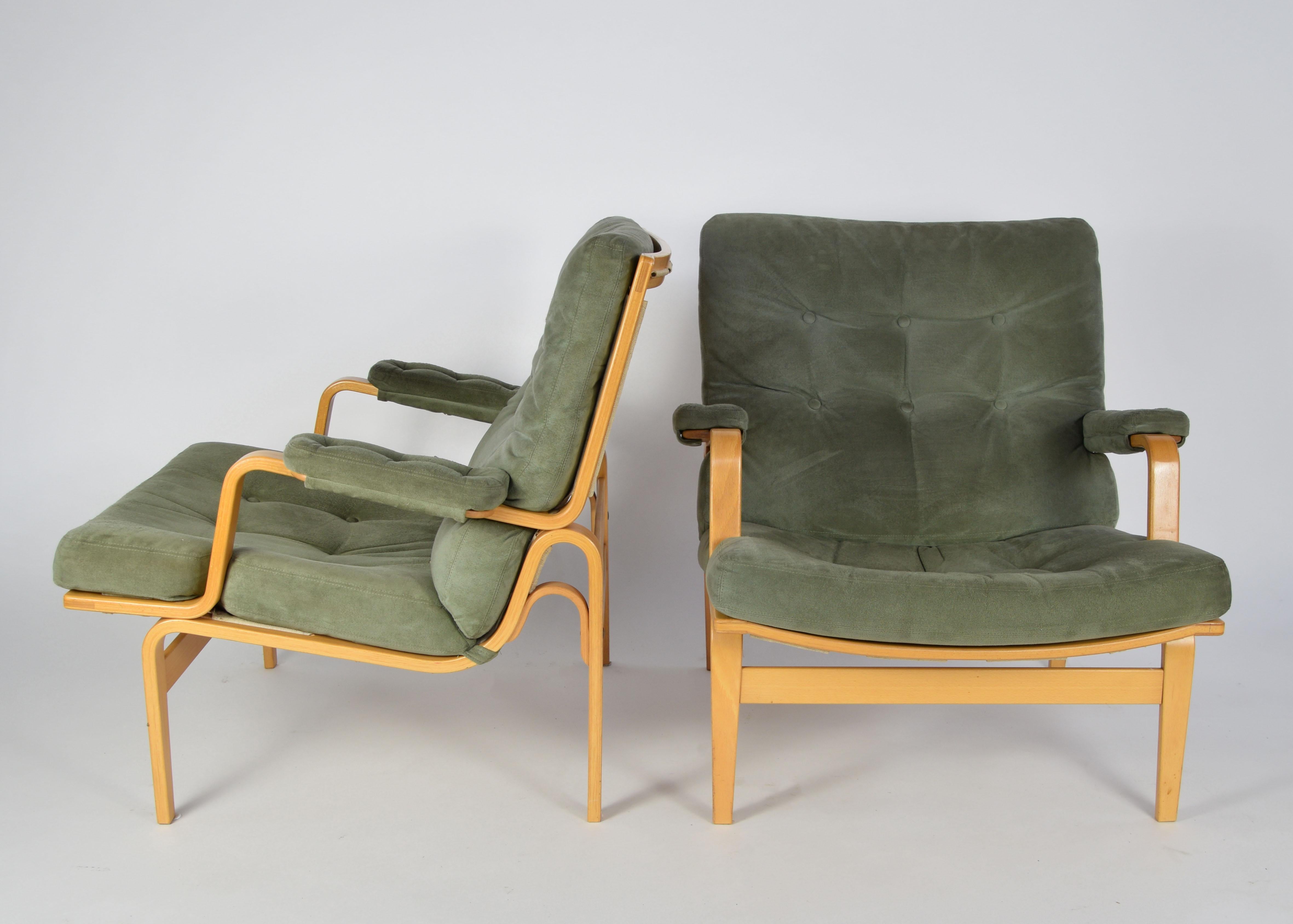 Wonderful pair of two lounge chairs Ingrid, designed by Bruno Mathsson for DUX in the 1970s.

Based in molded birch with original alcantara upholstery in dusty-grey-green.

Bruno Mathsson (1907–1988) was a Swedish furniture designer and architect