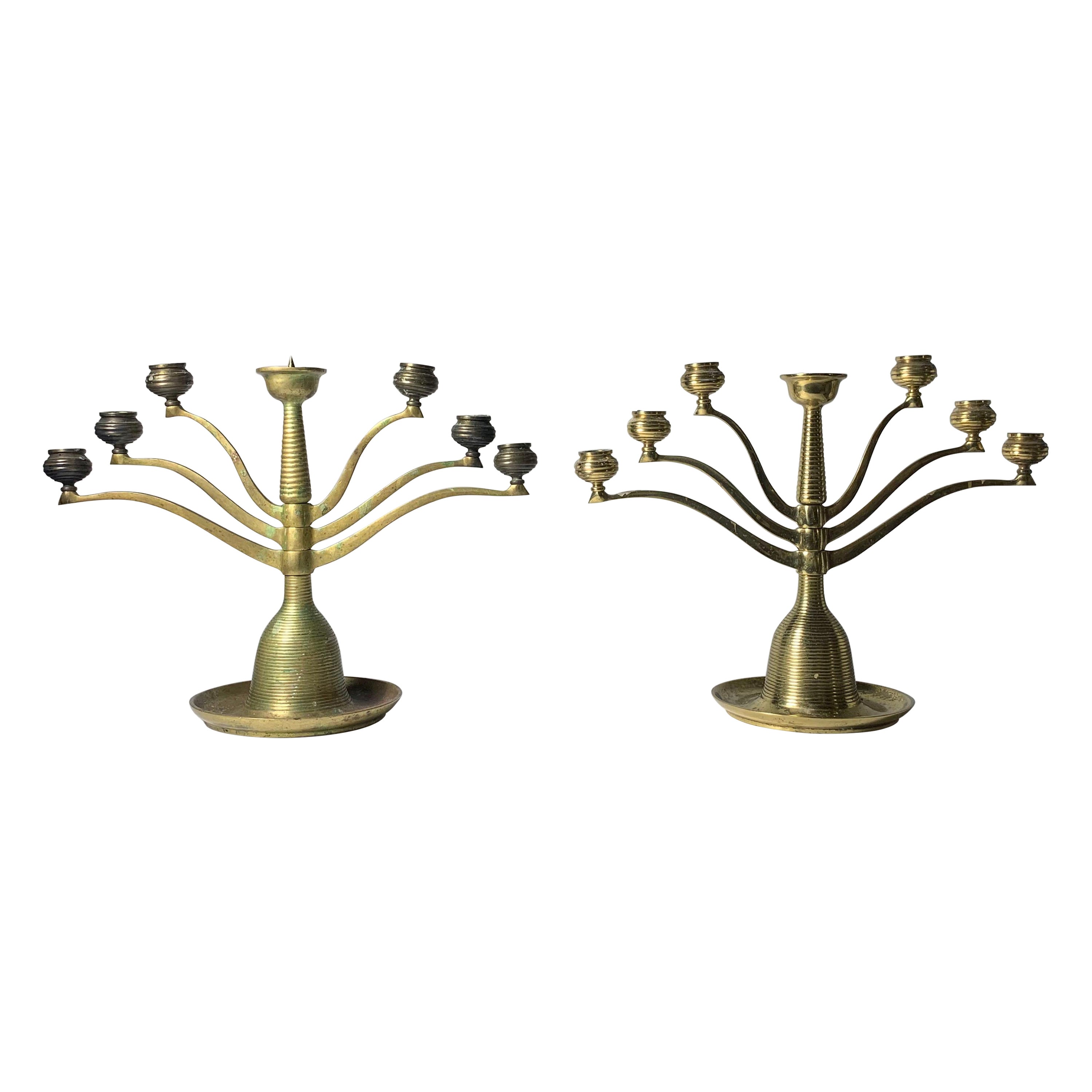 Pareja de candelabros articulados de bronce Bruno Paul