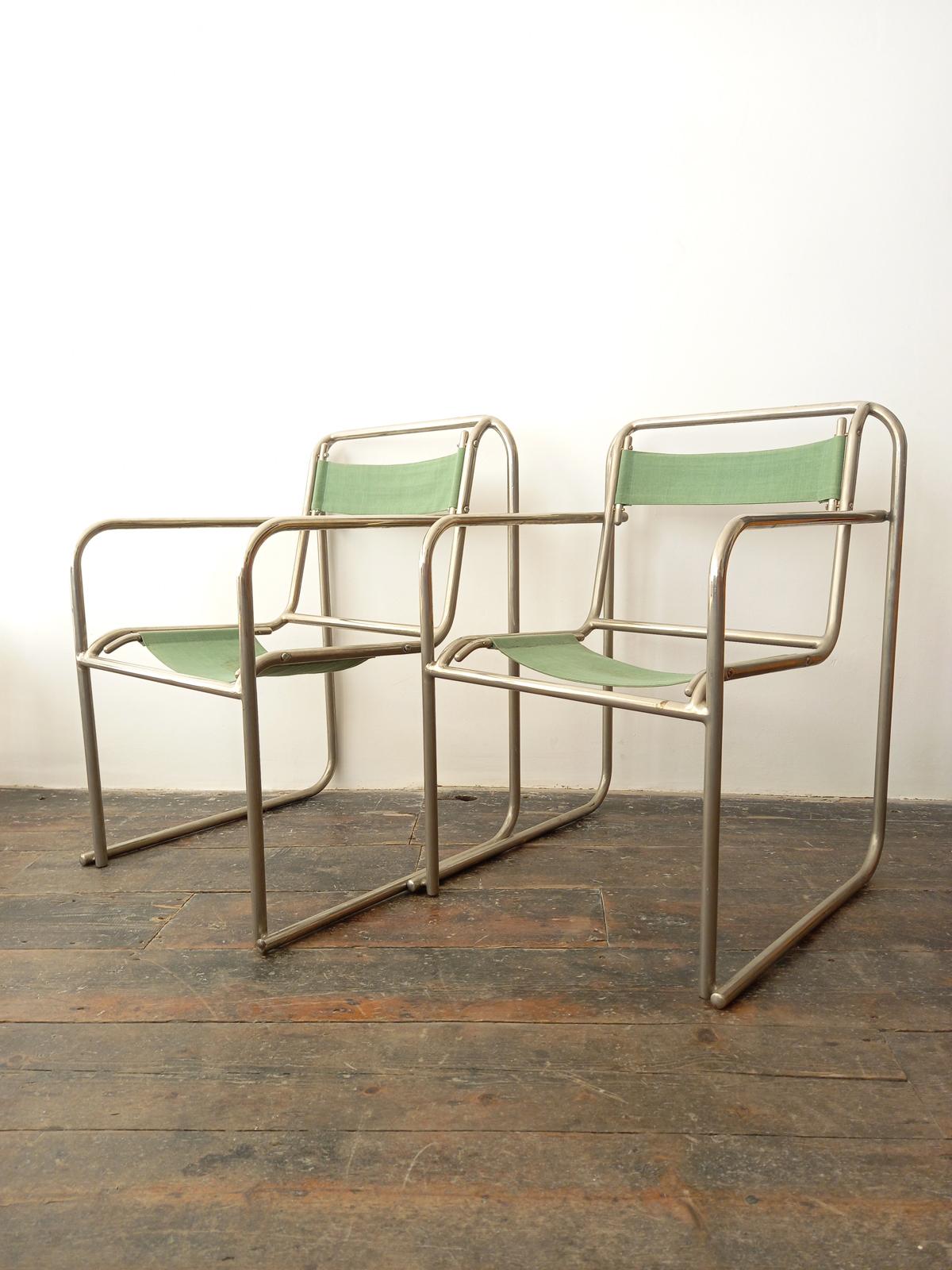 Bruno Polak Bauhaus stacking chairs with tubular chrome frames. In original condition with visible wear to the canvas Tubular steel and original green canvas. Set of 2. Bruno Pollack was an Austrian furniture designer who lived from 1902 to