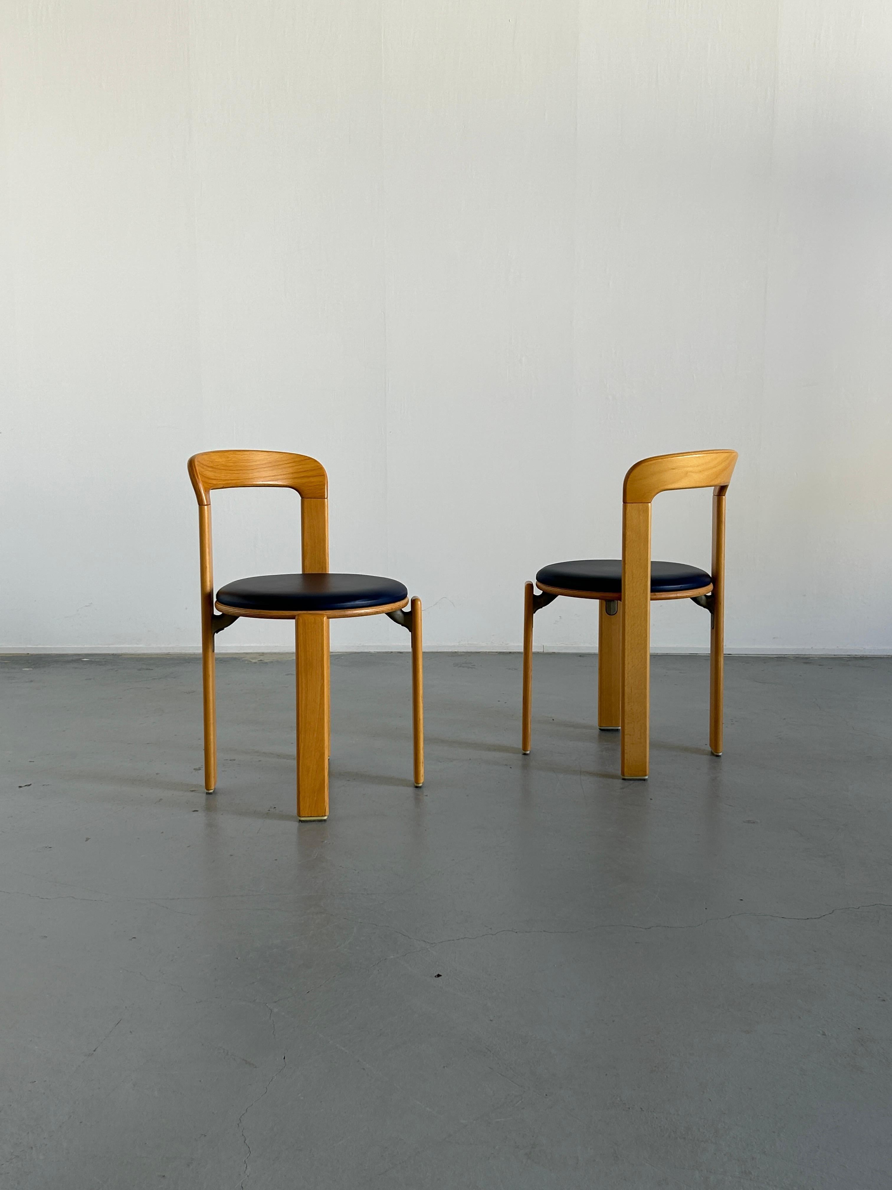 Pair of Mid-Century-Modern dining chairs designed by Bruno Rey in the 1970s. 
Iconic design, produced by the well known Germany manufacturer Kusch+Co in the early 1990s..

The dining chairs were made of solid beech, laminated plywood beech and cast