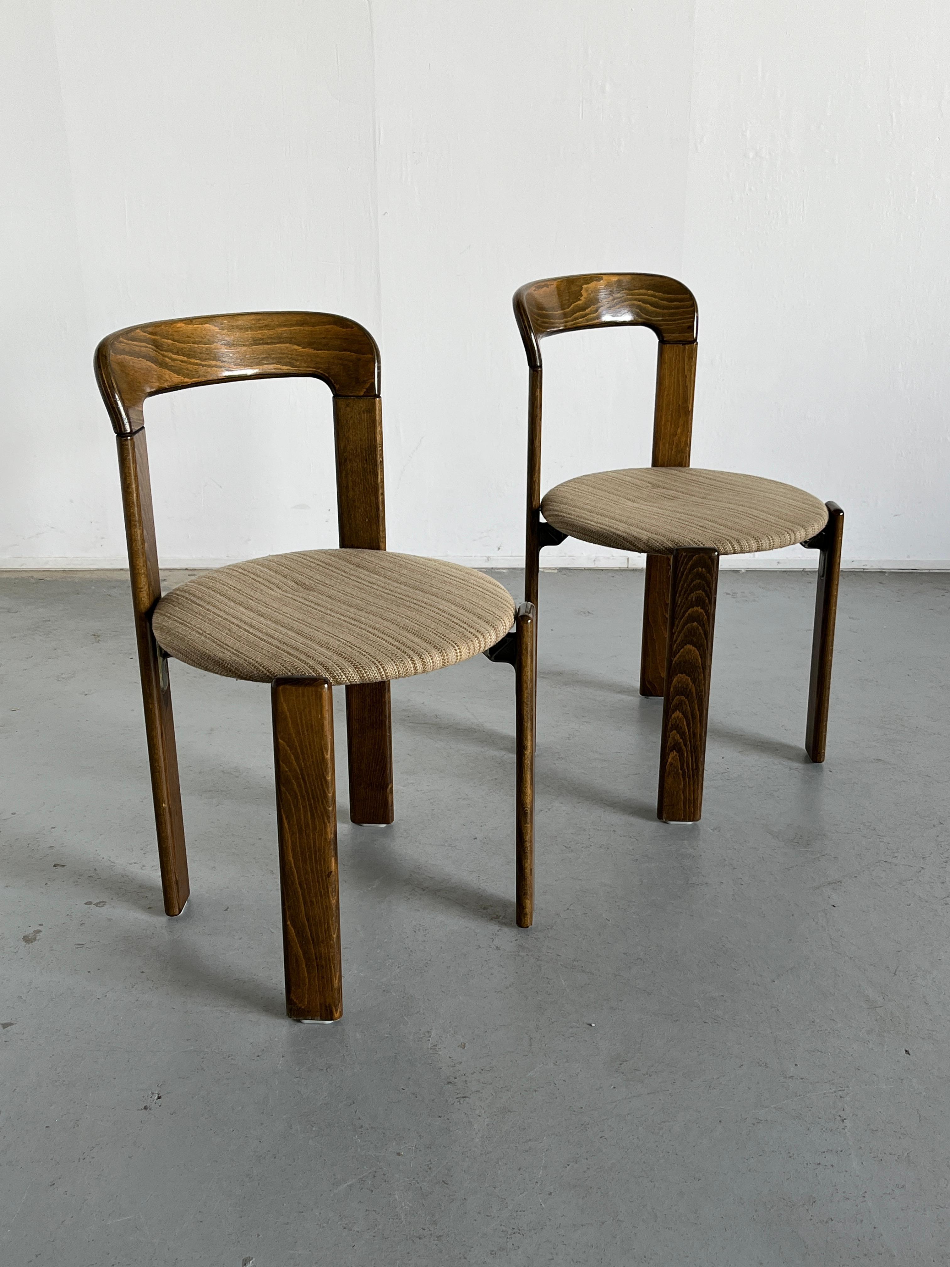Pair of Mid-Century-Modern dining chairs designed by Bruno Rey in the 1970s.
Iconic design, produced by the well known Germany manufacturer Kusch+Co in the early 1990s.
The dining chairs were made of solid beech and cast aluminium. Characteristic