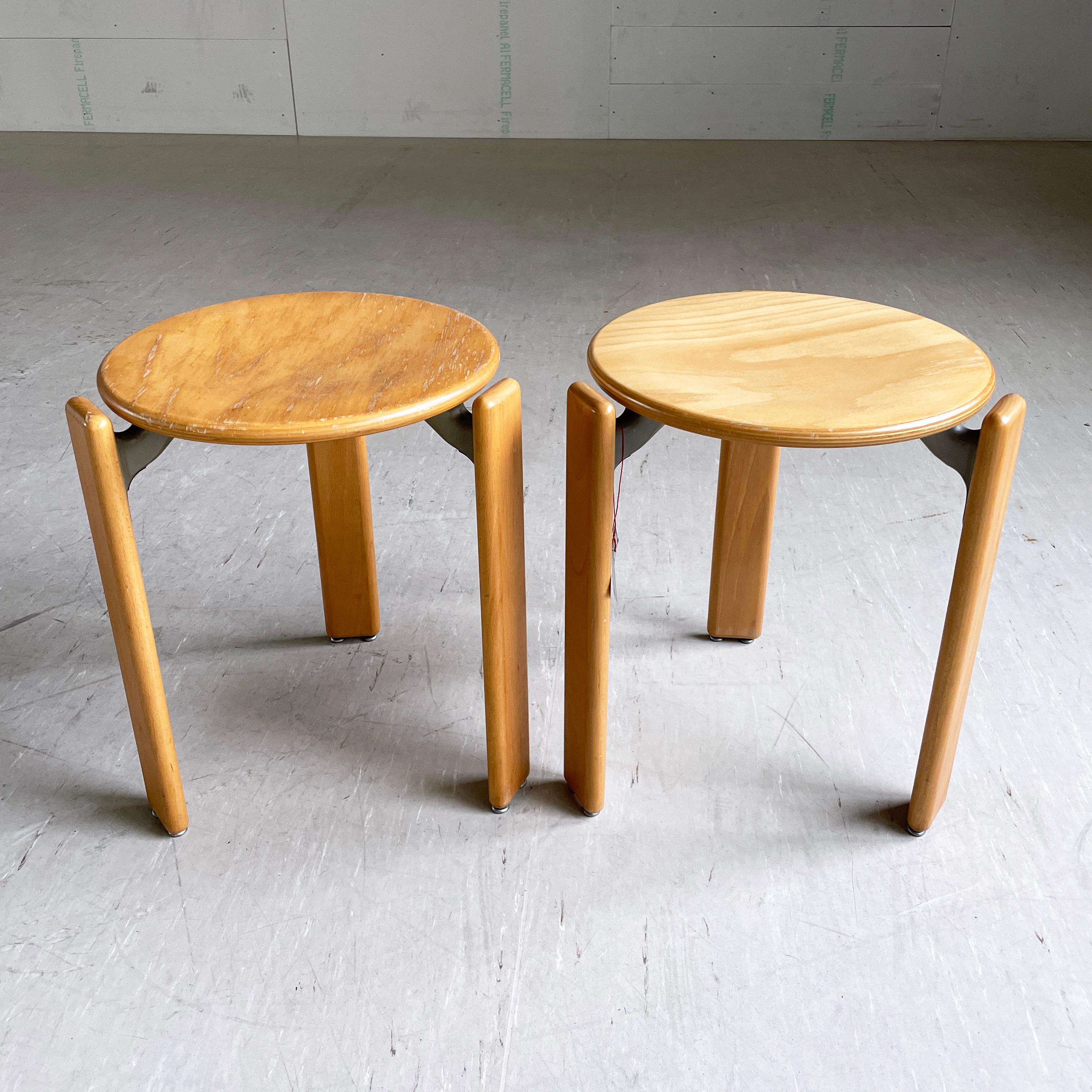 Pair of stackable stools designed by Bruno Rey, 1971. Made of solid beech. Iconic Swiss design. Produced by Dietiker, Switzerland. 
Stackable for easy storage and space saving. These also make very stylish indoor plant stands.
Water mark to one of