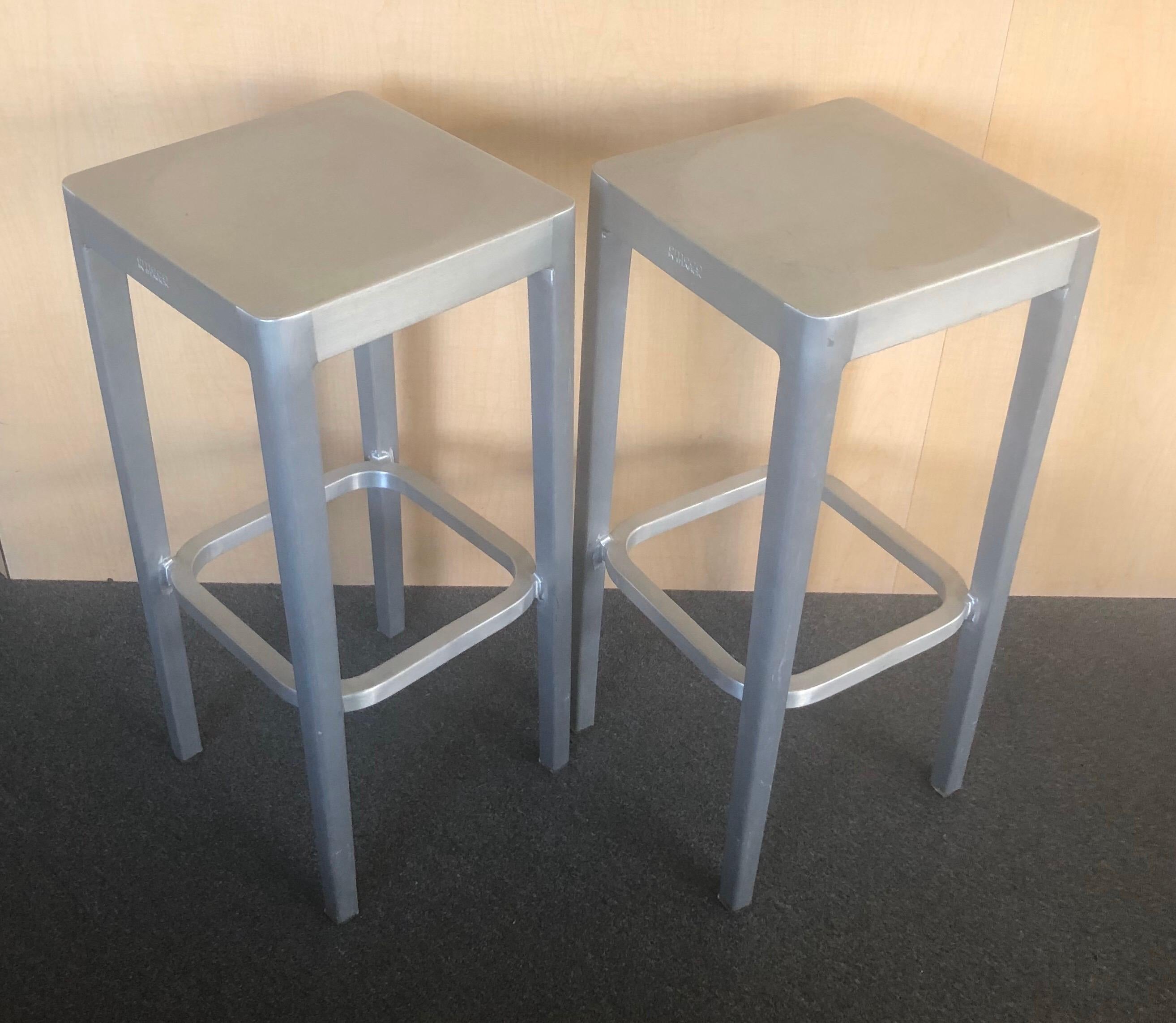 Sleek pair of brushed aluminum bar stools by Philippe Starck for Emeco, circa 1990s. Very sturdy and functional in very good vintage condition.