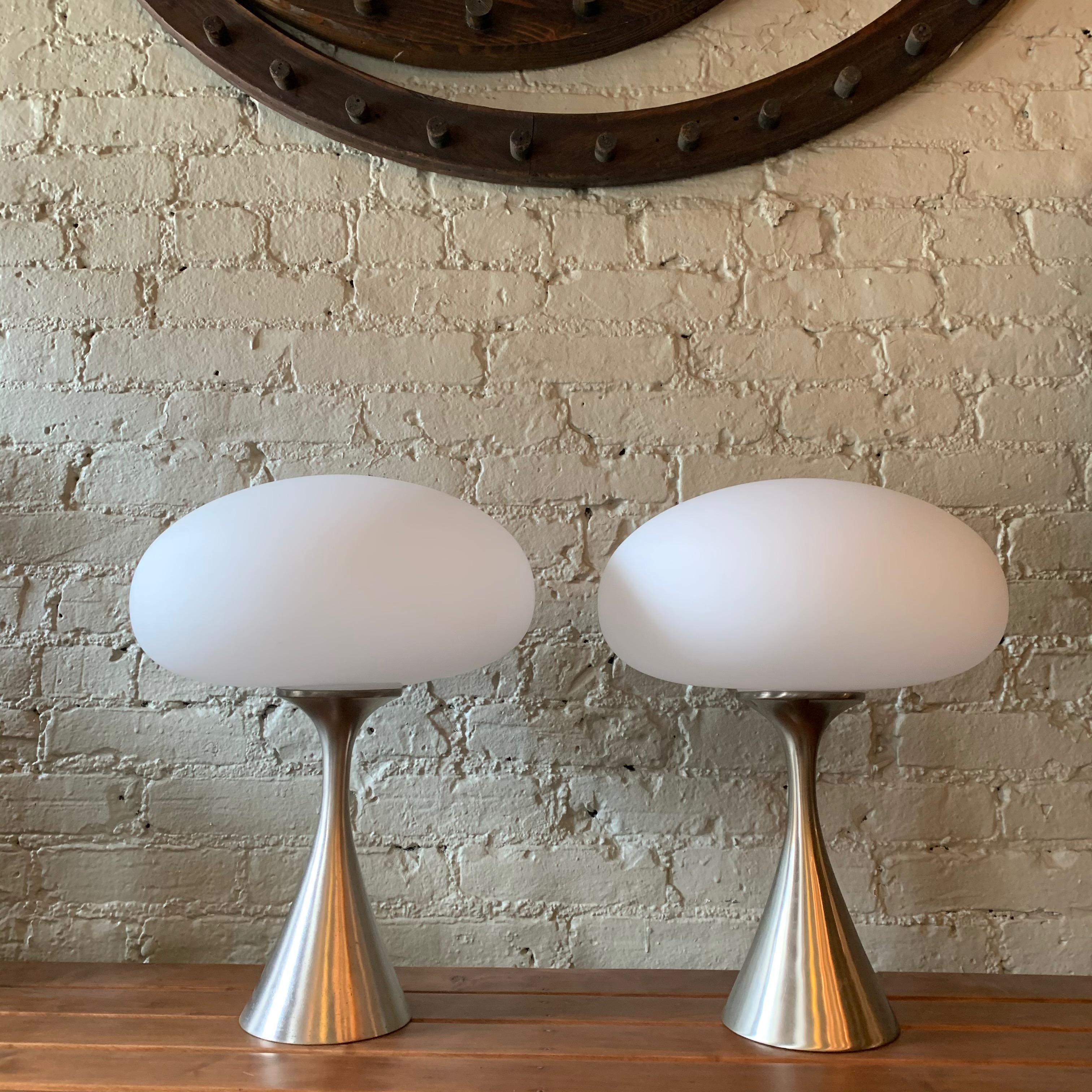Pair of Classic, Mid-Century Modern, mushroom table lamps by Bill Curry for Laurel Lamp Company, feature brushed aluminum bases with frosted glass shades.