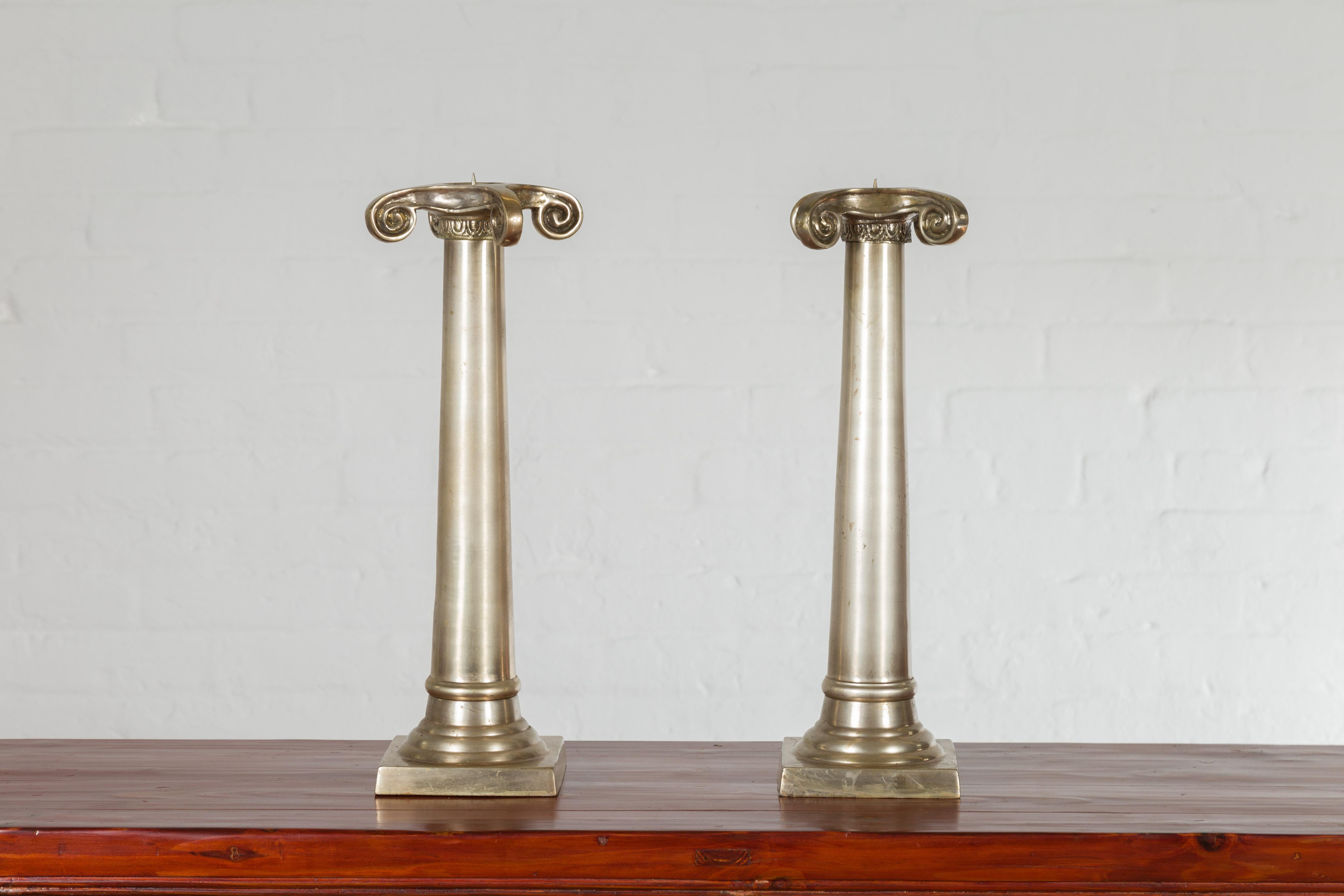 Thai Pair of Brushed Silver over Bronze Column Candlesticks with Large Ionic Capitals For Sale