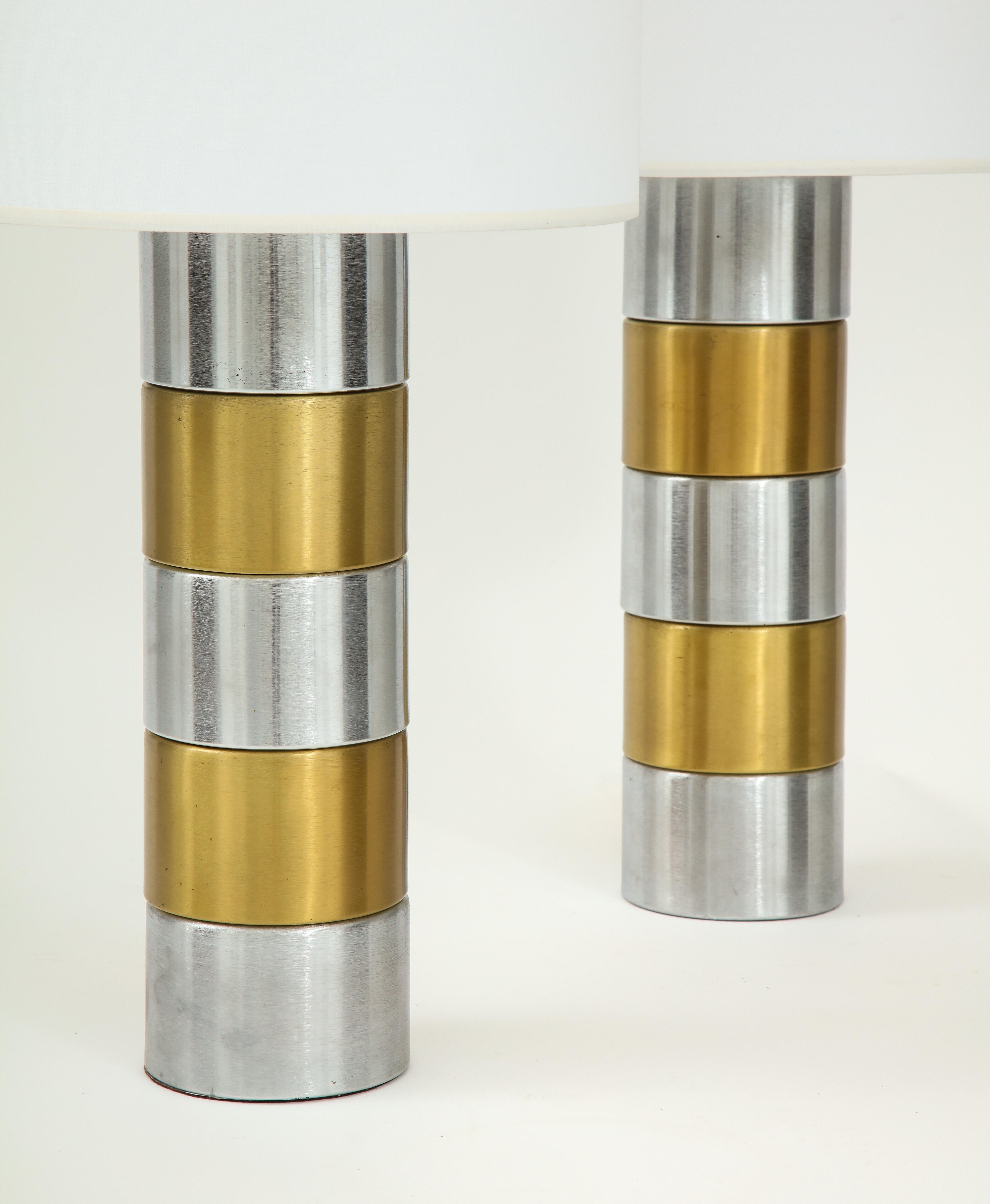 Pair of brushed steel and brass lamps.
The lamp shades are not included.