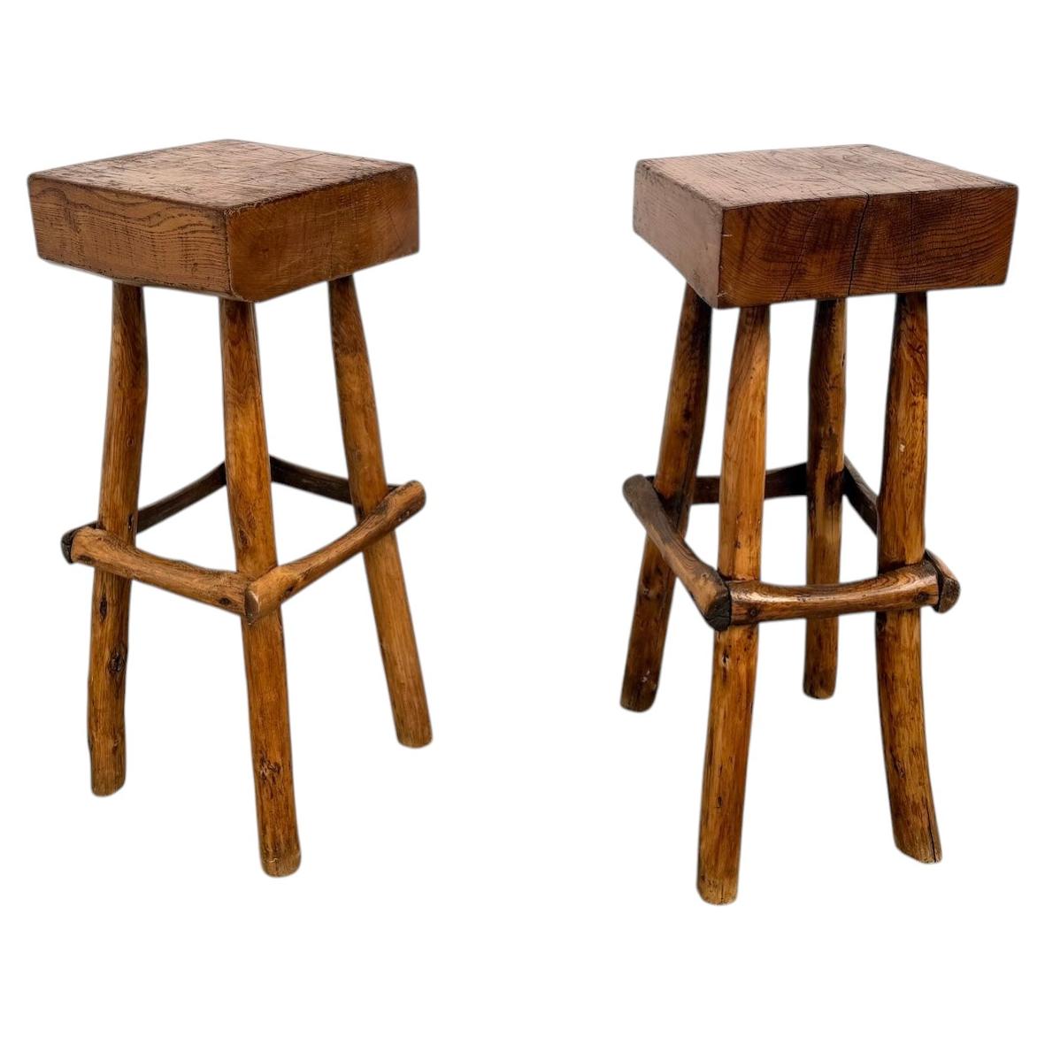 Pair of brutalist bar stools, France, 1950s For Sale