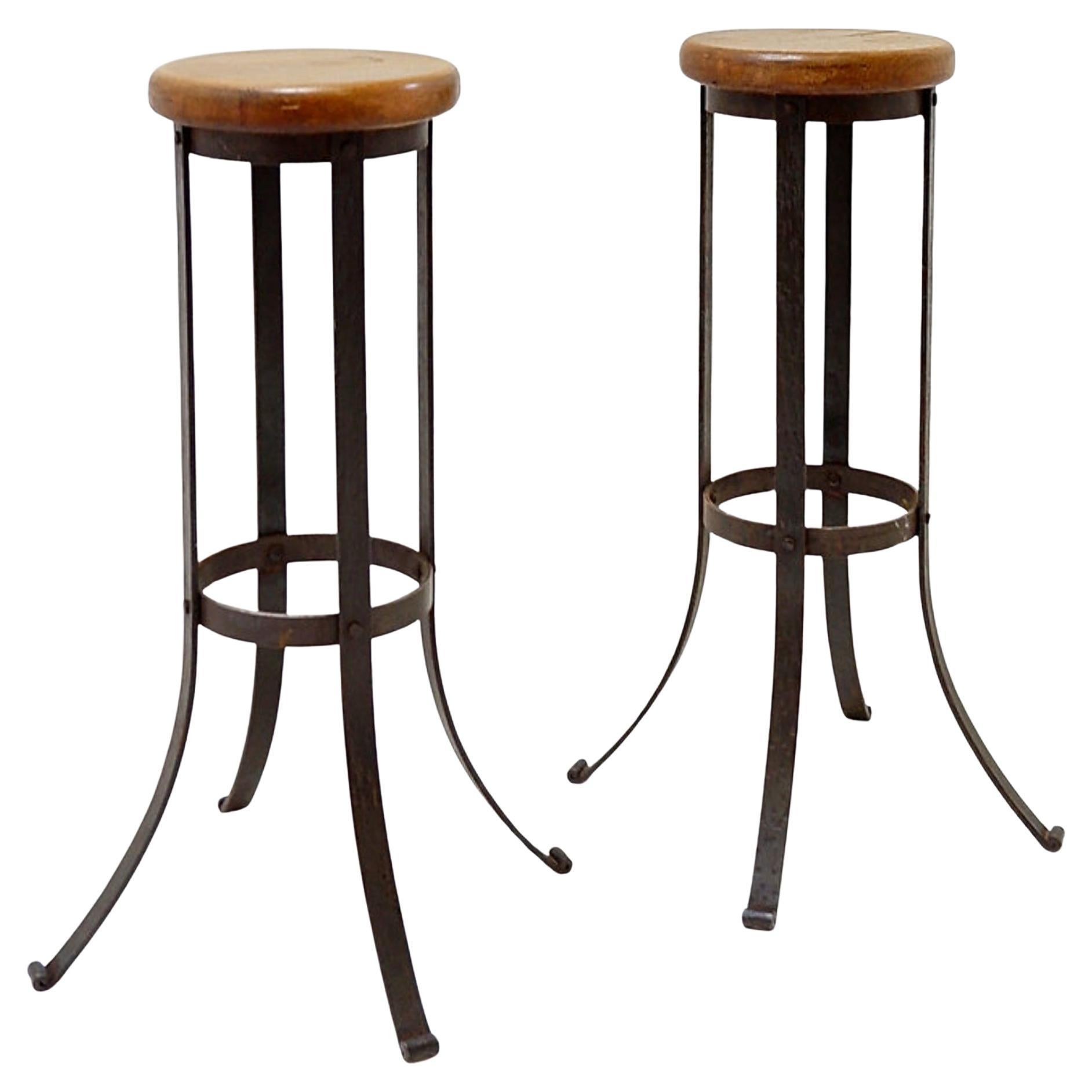 Pair of brutalist bar stools in oak and wrought iron, 1960s