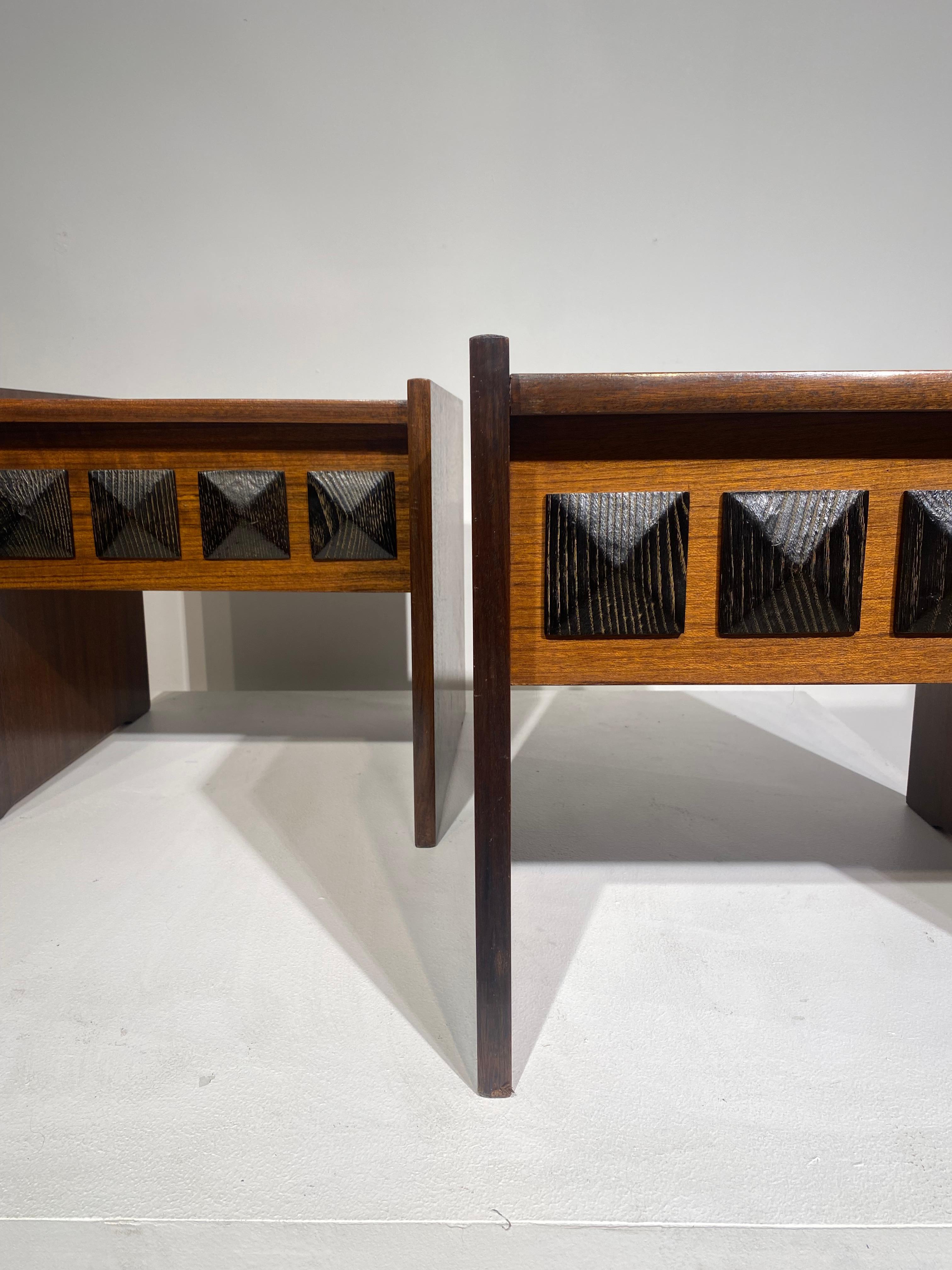 Nice pair of two side tables or bedsides tables with brutalist decor on the front part. They are no drawers. Really elegant work with two tones of wood, typical of brutalist style of design furniture in Europe during 60s and 70s. Those pieces