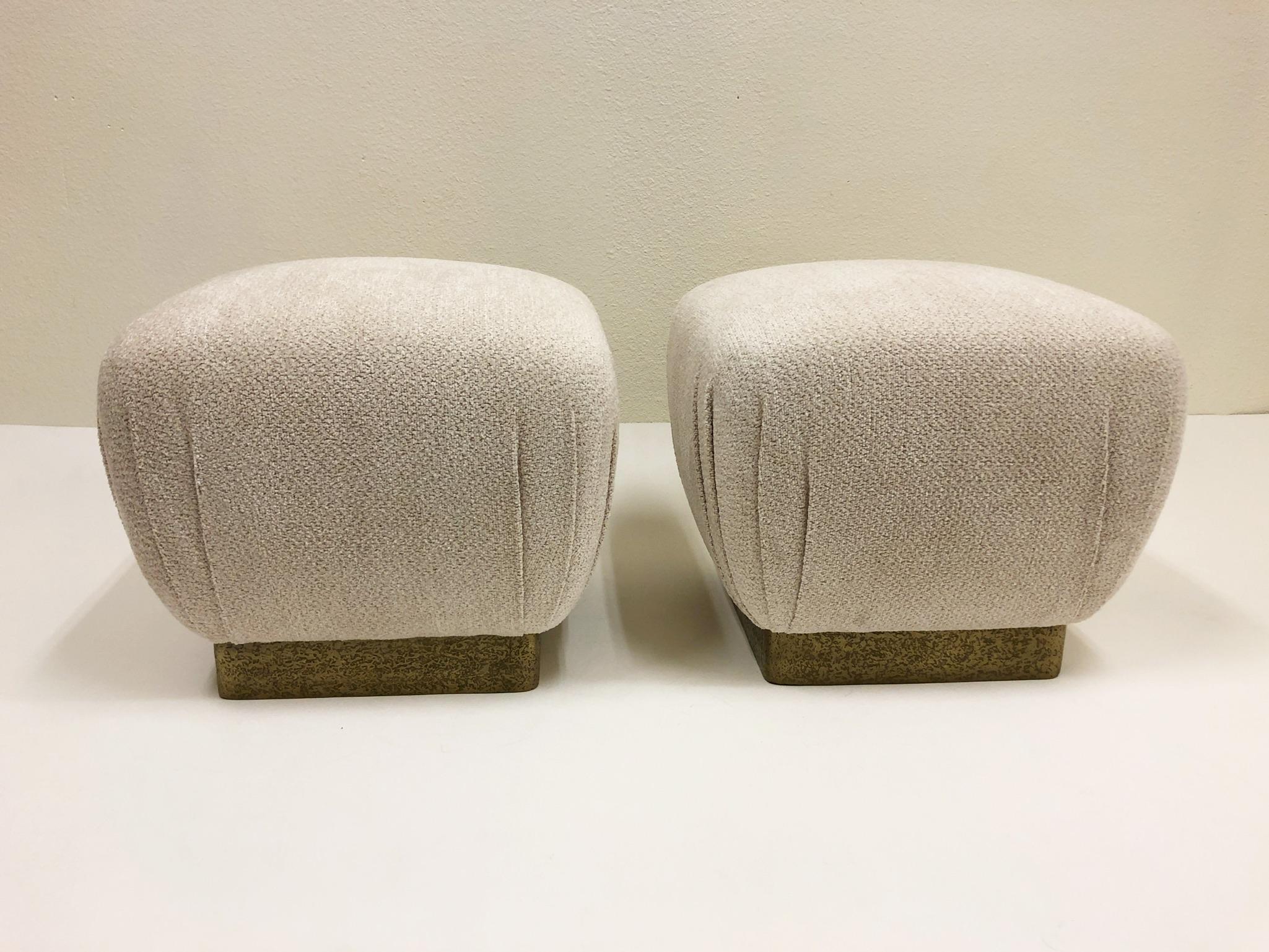 A beautiful pair of Poufs design by Marge Carson in the 1970s. The poufs are covered in a beautiful off white Chanel fabric and the bases have a custom Brutalist brass finish (see detail photos).

Dimensions: 17.5” high, 20” wide, 20” deep.