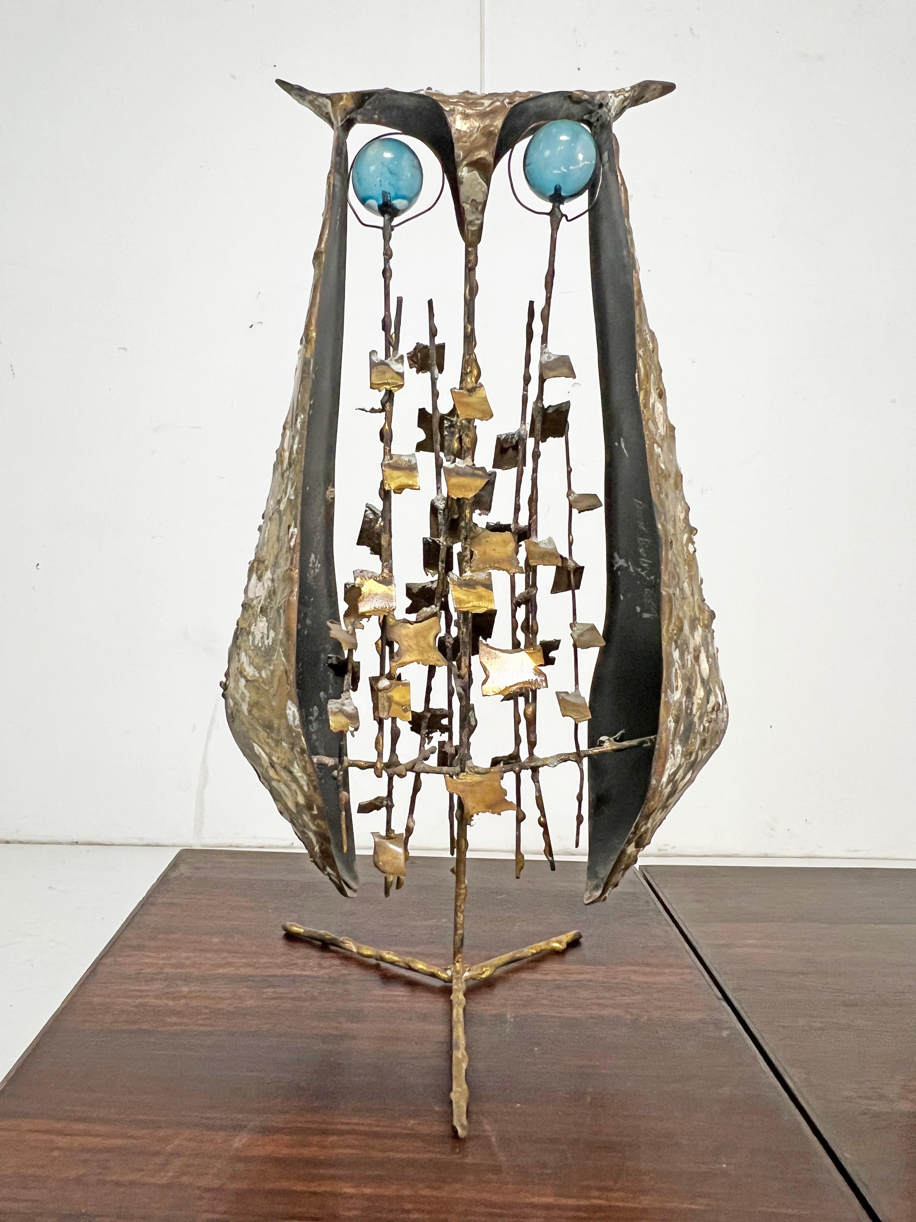 A rare pair of modernist bronze owls in the brutalist style by the American sculptor Don Budy of Michigan, IL and Carmel, CA. Both feature acrylic ball eyes and brazed elements. The smaller owl also features a pierced enameled panel at the