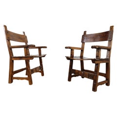 Pair of brutalist carved wooden spanish armchairs, 1960s 