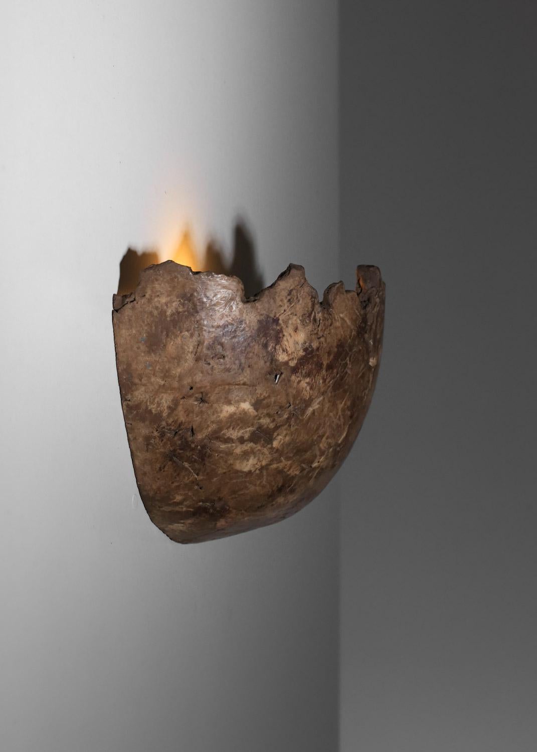 Pair of 20th-century French Brutalist wall sconces by Pellizon. Entirely ceramic half-spheres, crafted in a rough manner with a very mineral finish and color similar to stone. Beautiful vintage condition, with slight signs of age and use (see