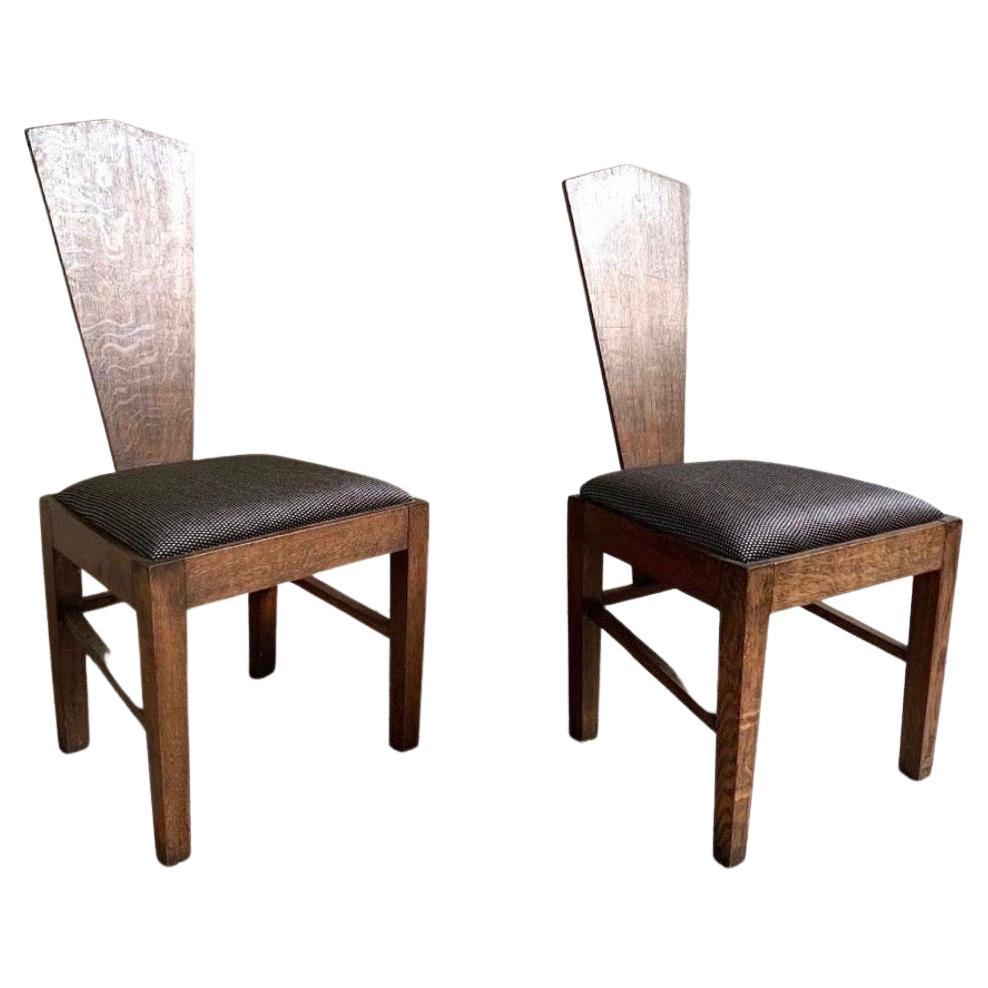 Pair of brutalist chairs in oak with fabric seat, circa 1960.