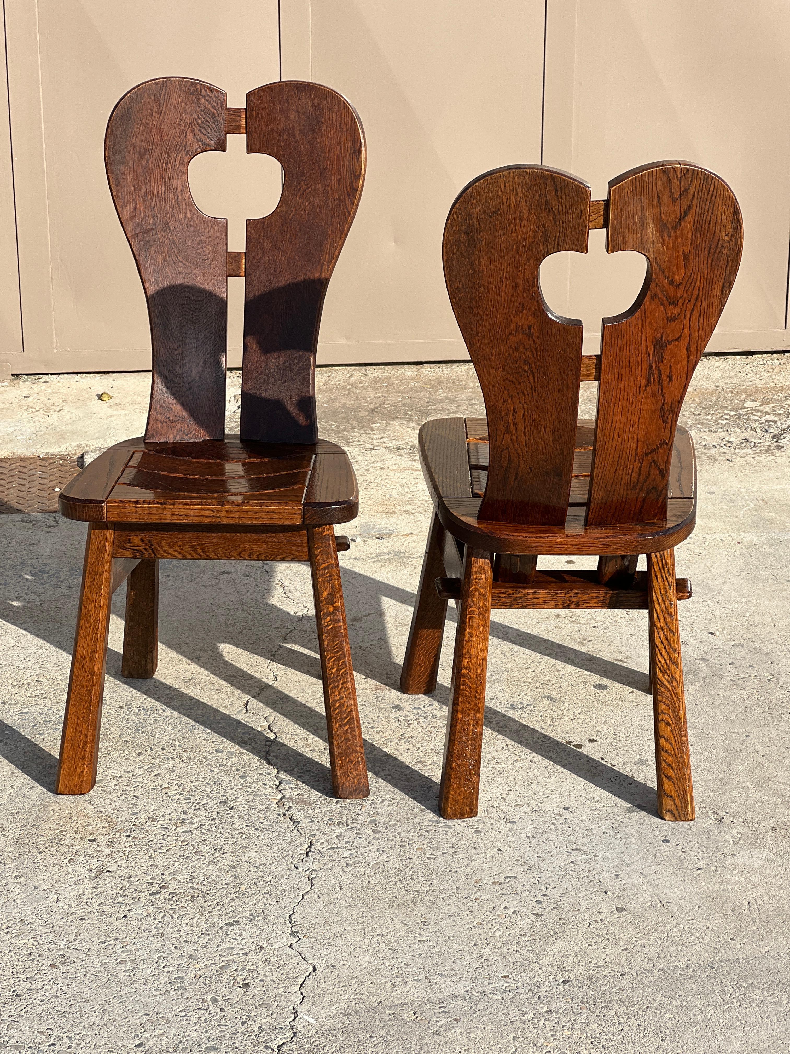 Pair of brutalist chairs in solid wood 1940 in solid oak in the style of De Puydt.
 