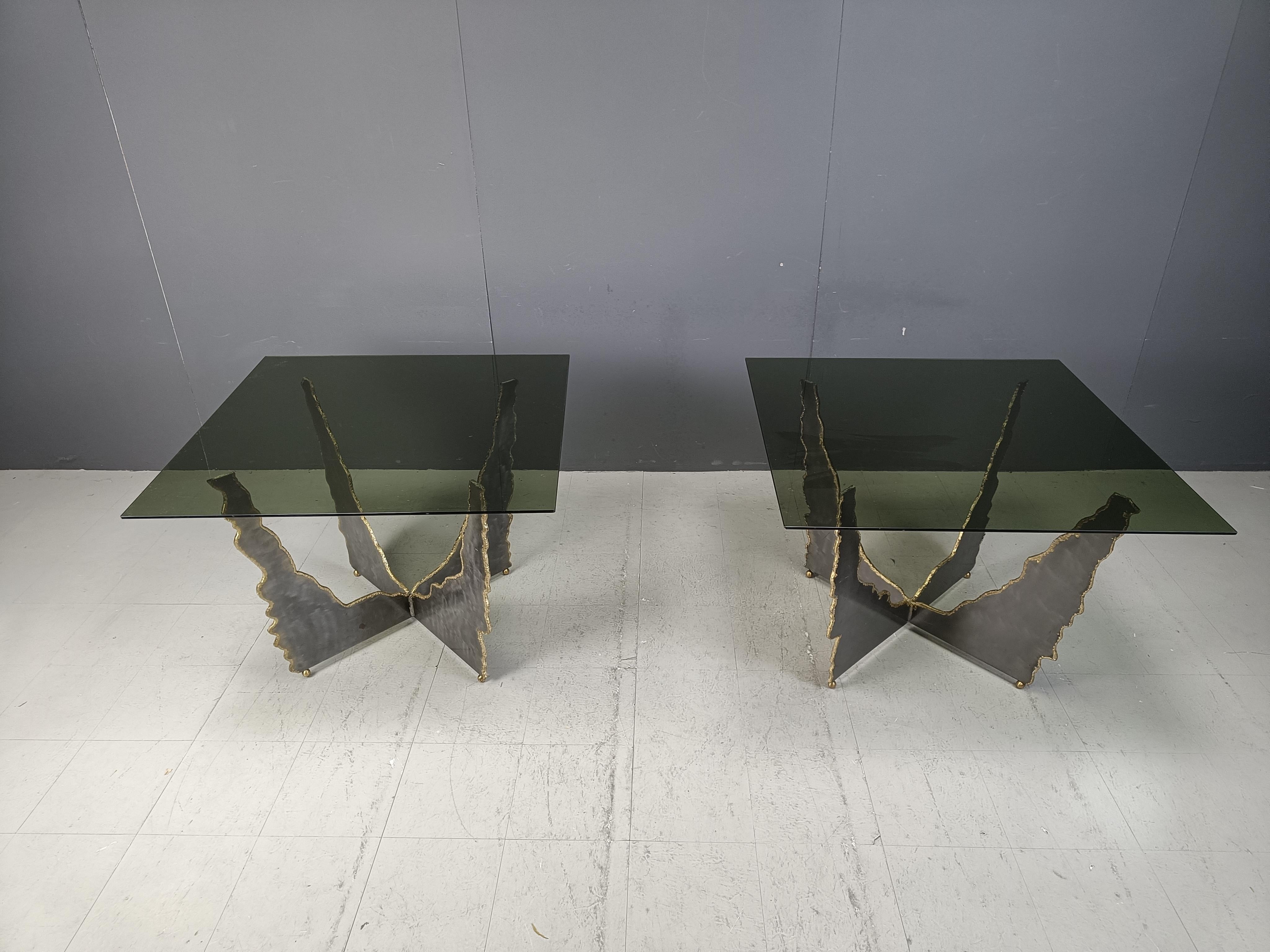 Pair of sculptural cut steel and brass coffee tables or side tables with a smoked glass top.

Real pieces of art that will upgrade your living room.

1970s - Belgium

Dimensions:
Height: 72cm
Width x depth: 102cm

Ref.: 25011511

*All images are