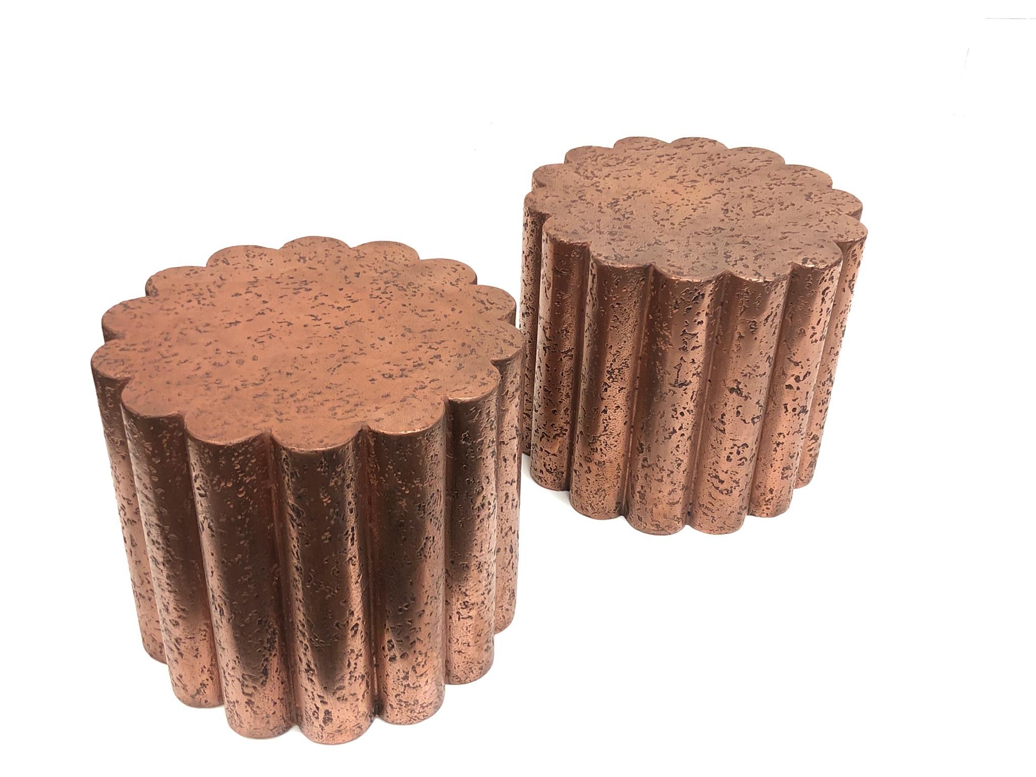 A pair of custom Brutalist flower shape side tables designed by Steve Chase in the 1980s. The tables are constructed of wood that’s covered with plaster and painted with powder copper.
Dimension: 19” diameter, 16.5” high.