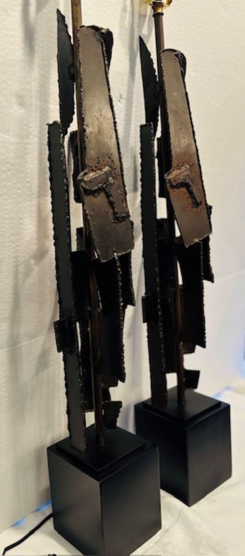 Pair of Brutalist Iron Table Lamps, Richard Barr for Laurel Lamp Company, Iron slabs are cut by a torch cut and welded into the sculptural design.  One pole is lower than the other but the harp height makes up for the height difference. These lamps