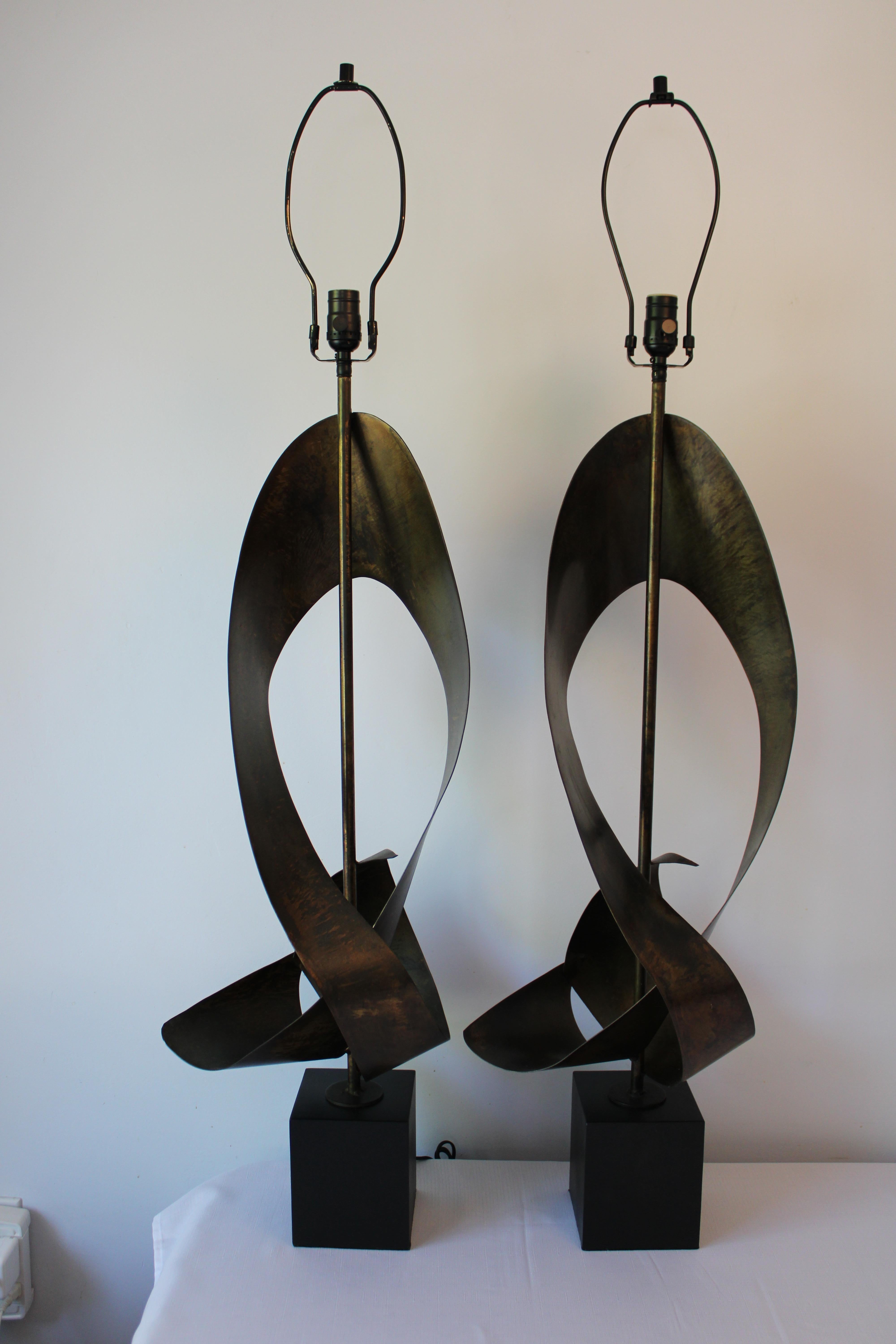 Brutalist ribbon cut lamps by Richard Barr and Harold Weiss (founder) for the Laurel Lamp Company, Newark, N.J.   Abstracted ribbon shape on black enamel painted square base. Lamps have been professionally rewired for 3-way light bulbs. Lamps