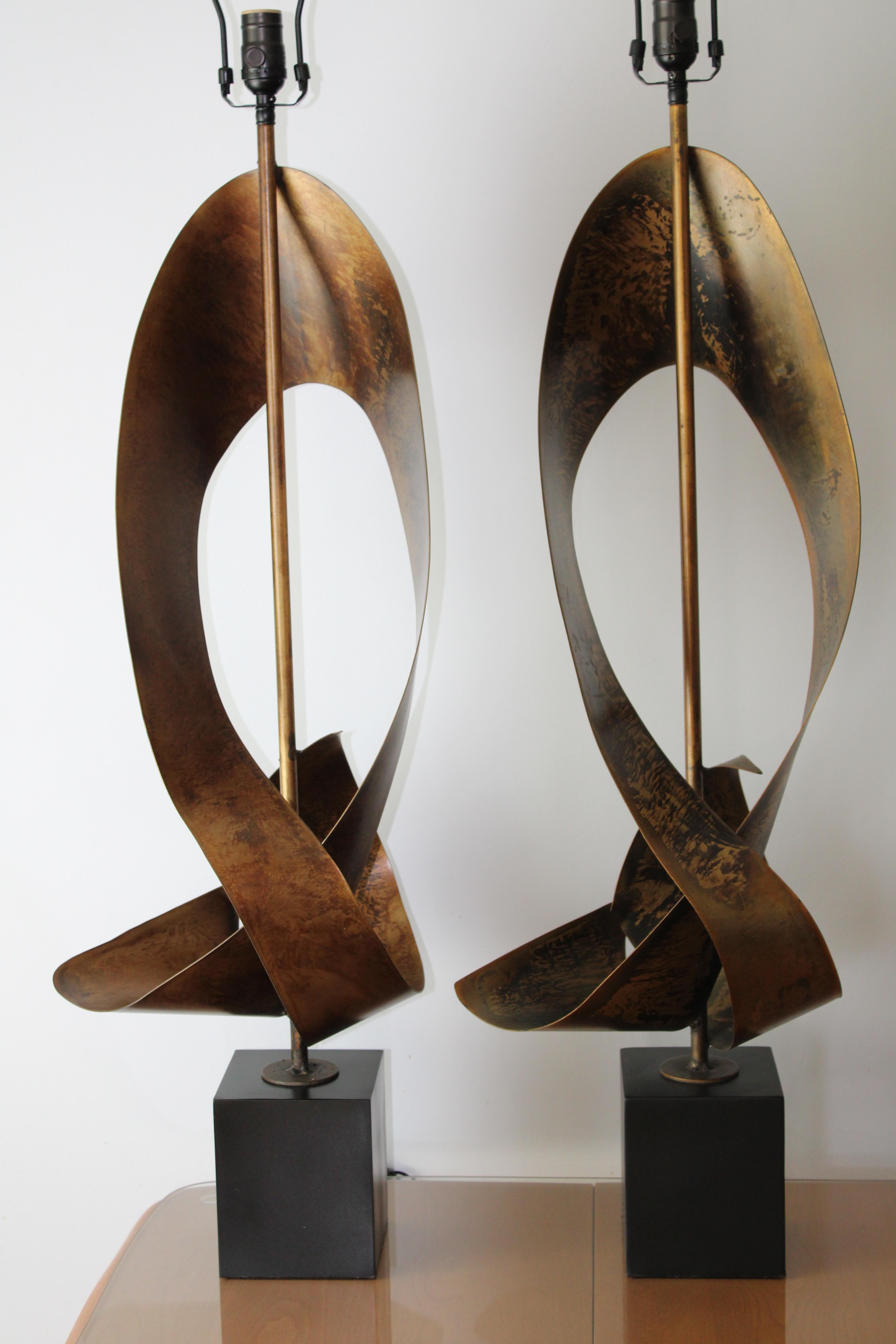 Brutalist ribbon cut lamps by Richard Barr and Harold Weiss (founder) for the Laurel Lamp Company, Newark, N.J. Abstracted ribbon shape on black enamel painted square base. Lamps have been professionally rewired for 3-way light bulbs. Lamps measures