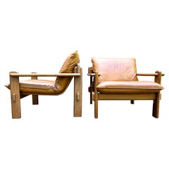 Pair of Brutalist Leather & Wood Armchairs in the style of Jean Gillon, 1960's