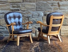 Pair of Brutalist oak and leather lounge chairs - style of Guillerme et Chambron