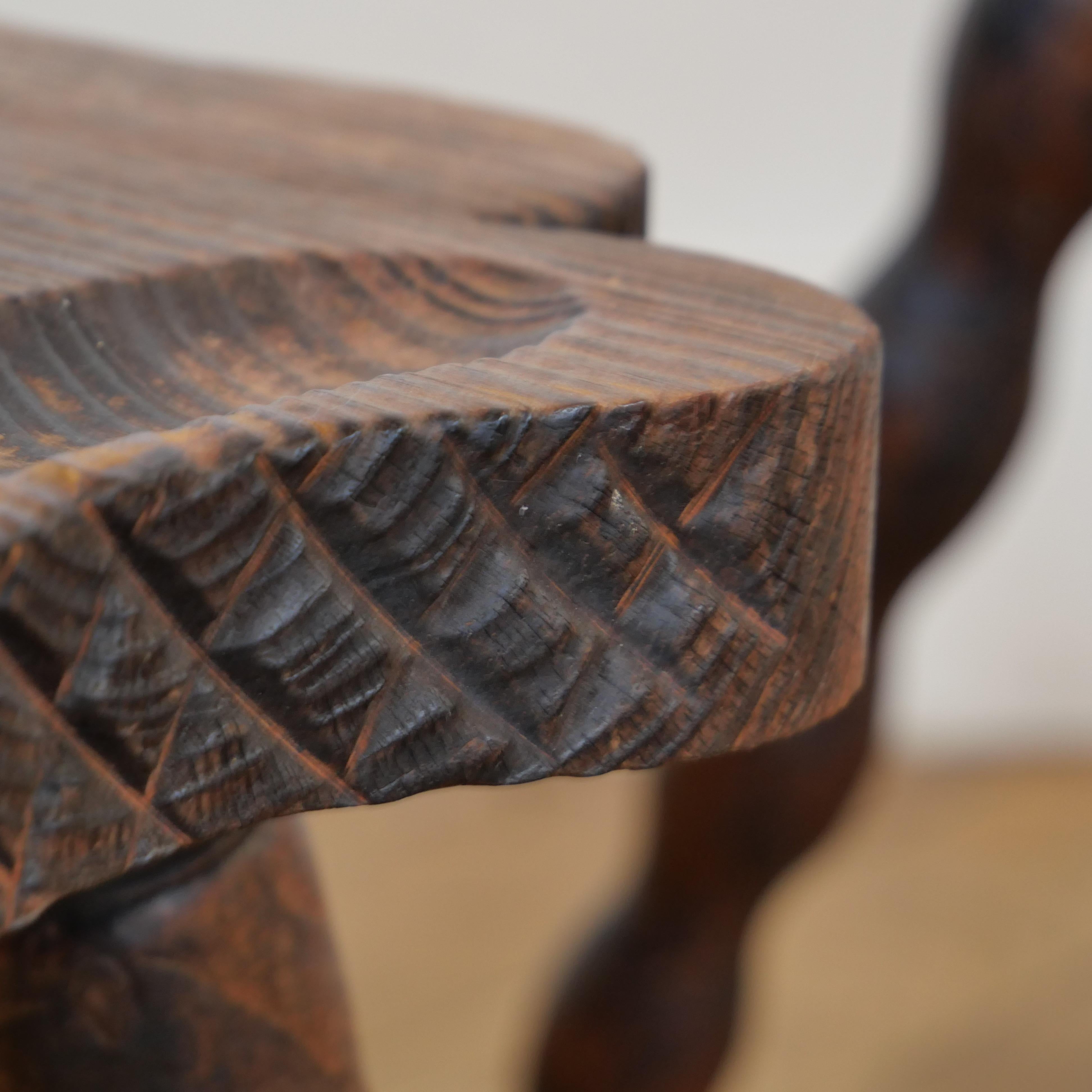 Pair of brutalist oak tripod milking stools. 2