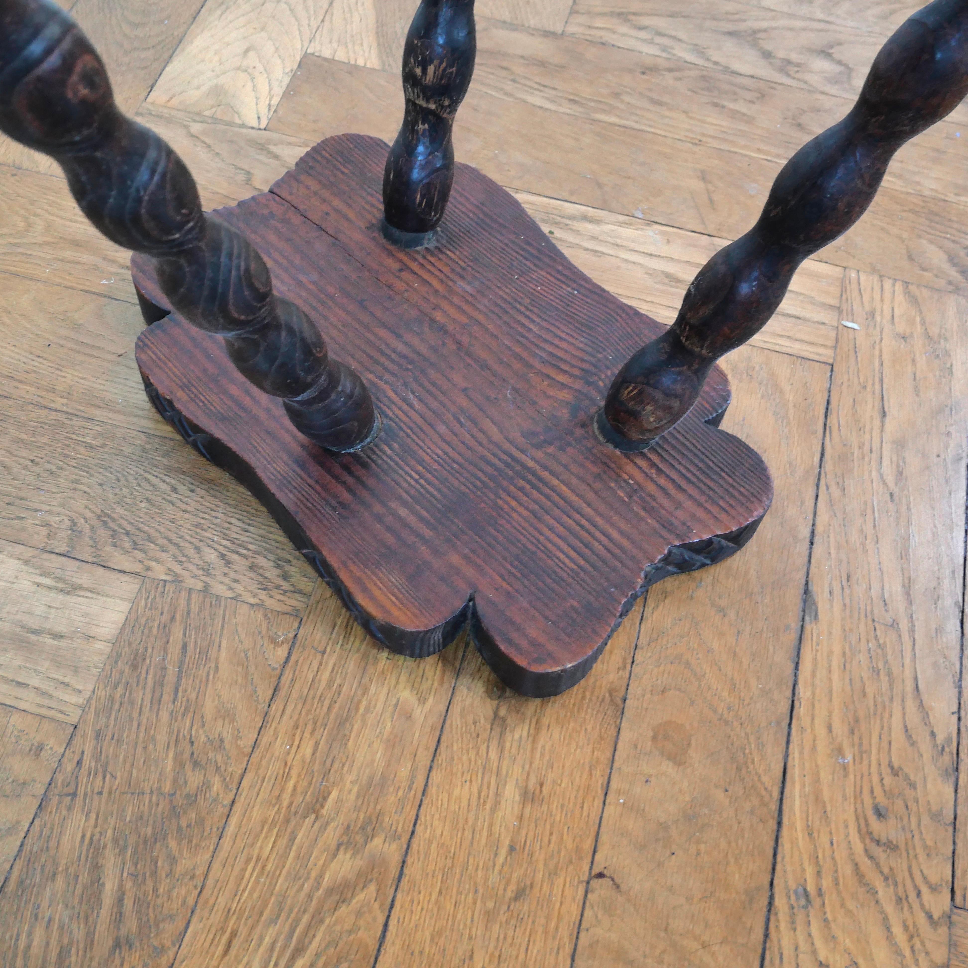 Pair of brutalist oak tripod milking stools. 3