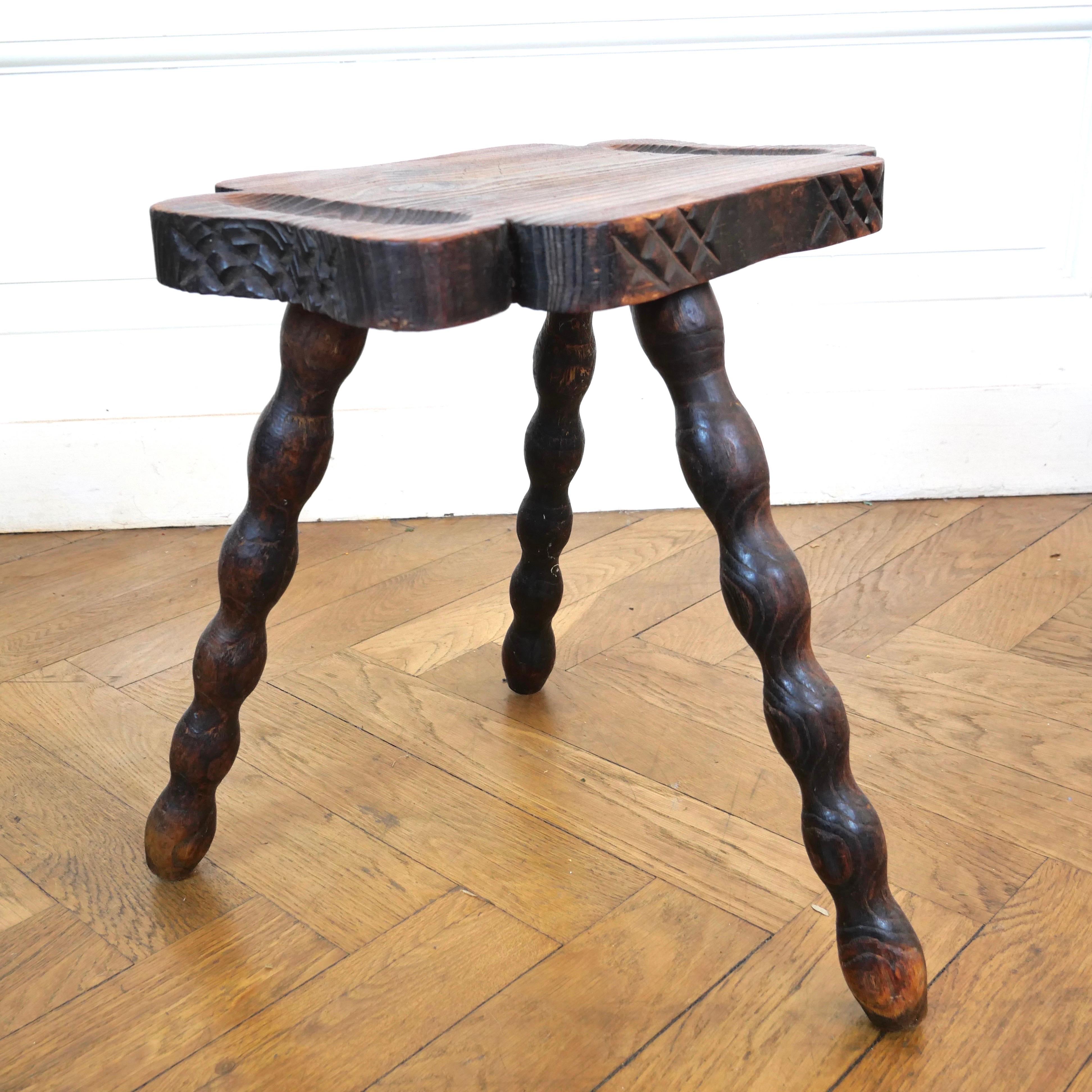 Pair of carved oak milking stools. Slightly differently from each other. one is taller with bobbin Legs the other is smaller with a more traditional turned leg. 
I have heard these described as Spanish but I can't confirm. 
Structurally strong and