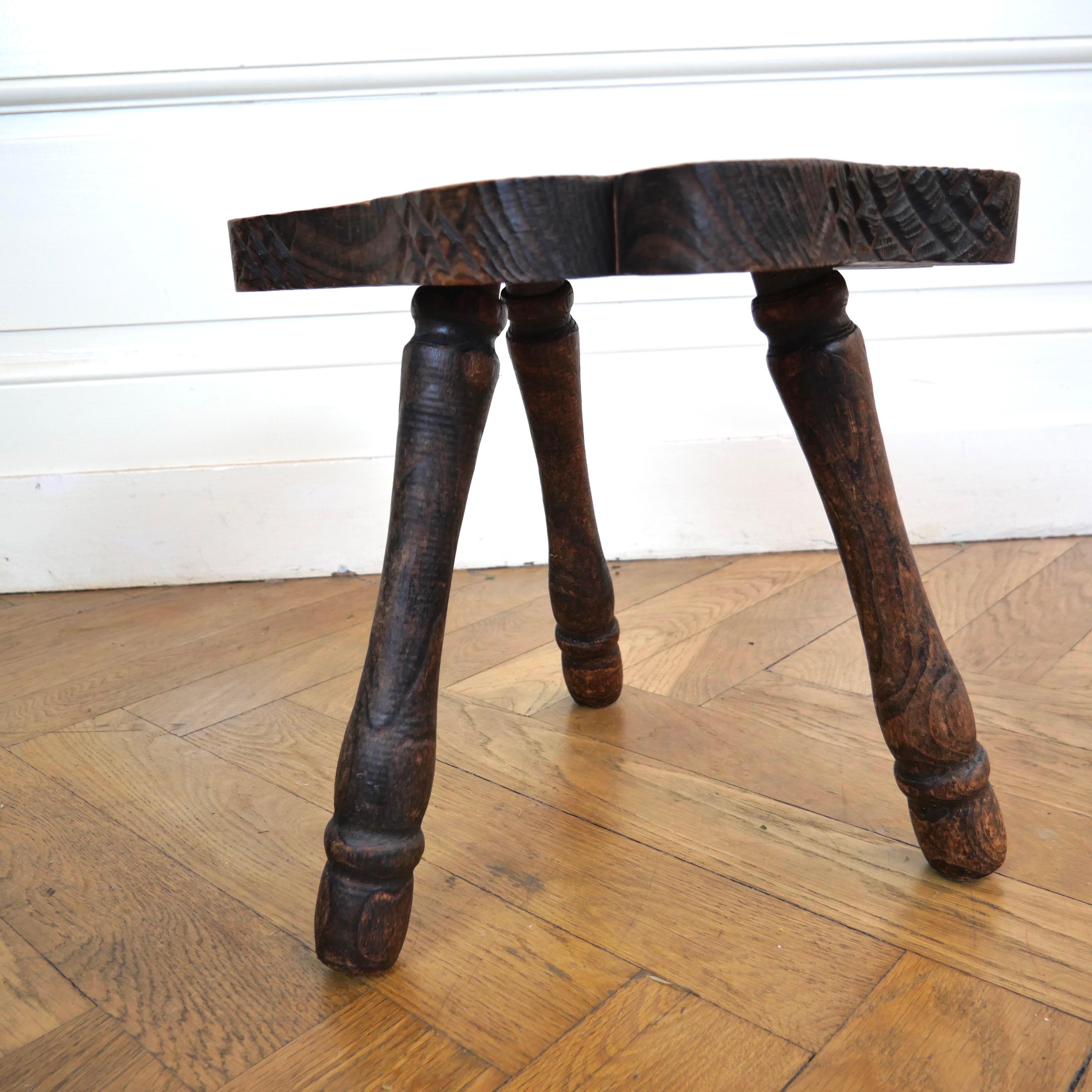 French Pair of brutalist oak tripod milking stools.