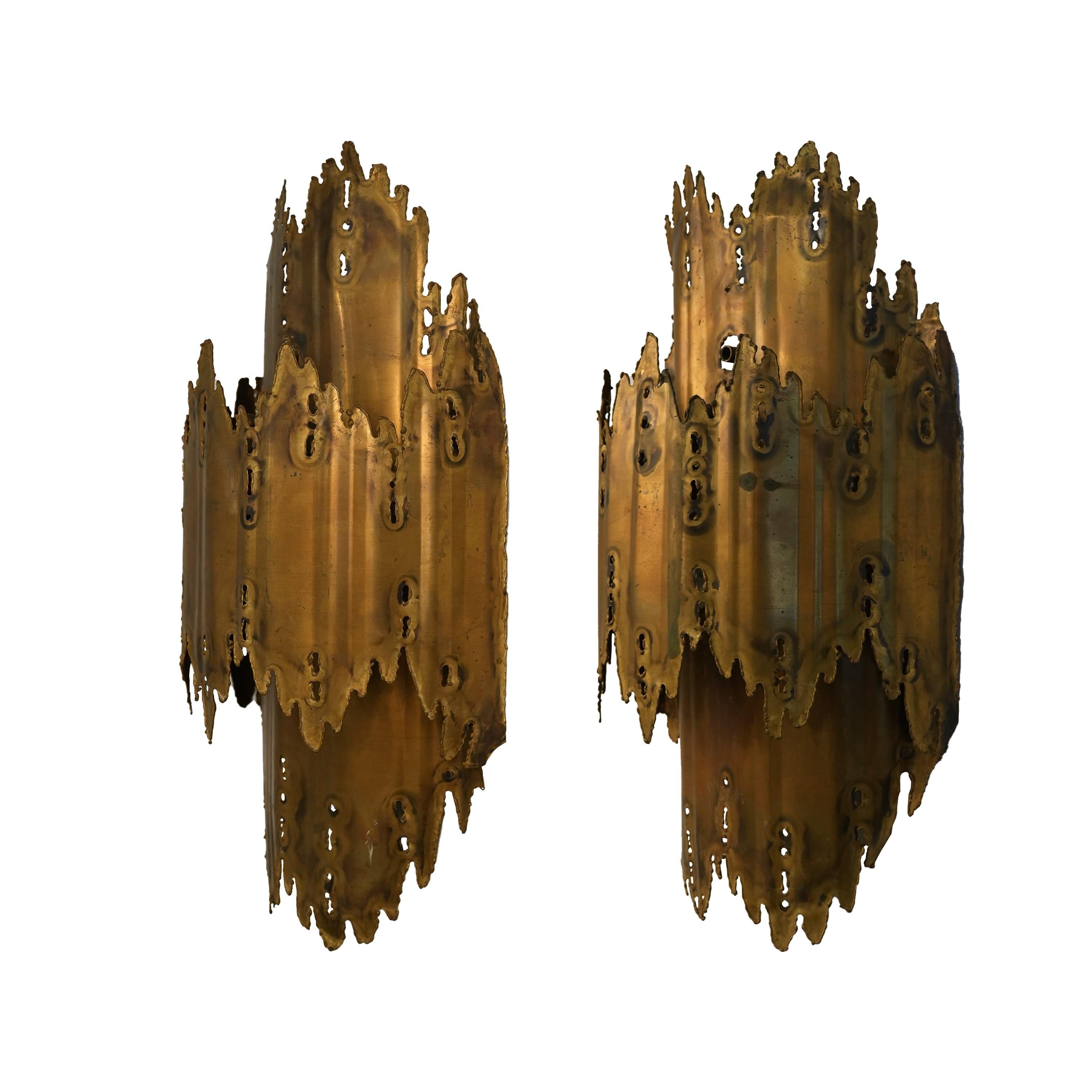 Beautiful pair of burnished brass torch cut brutalist sconces.  Good condition, vintage from the mid sixties.
Has original patina and these are hardwired. 