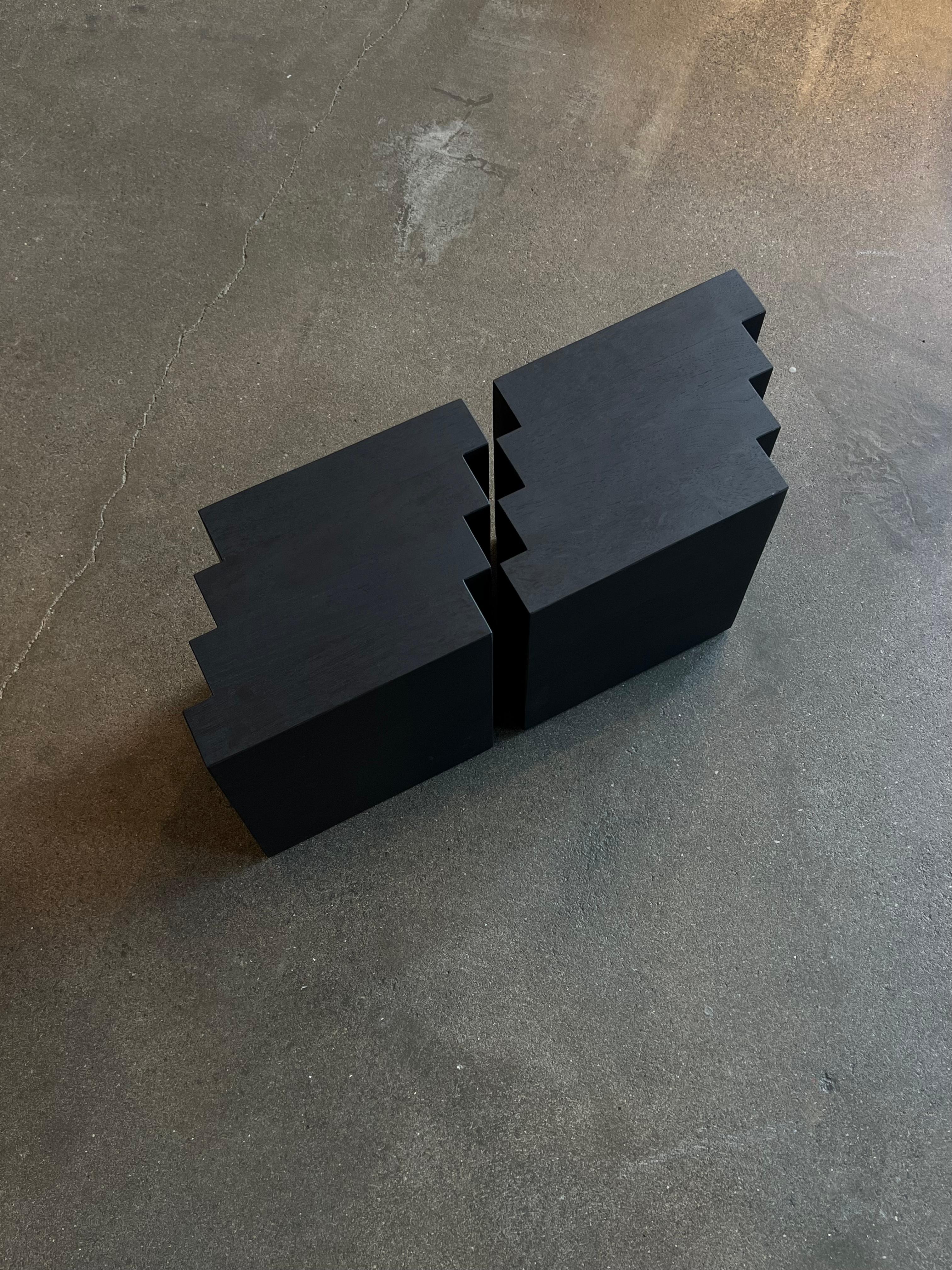 These solid oak Cadence side tables are showroom models in excellent condition. 
- Dimensions per side table: L:34 x W:22 x H:30 cm. 
- The price includes a custom wooden shipping crate. 
- The thick solid wooden beams may contain small knots