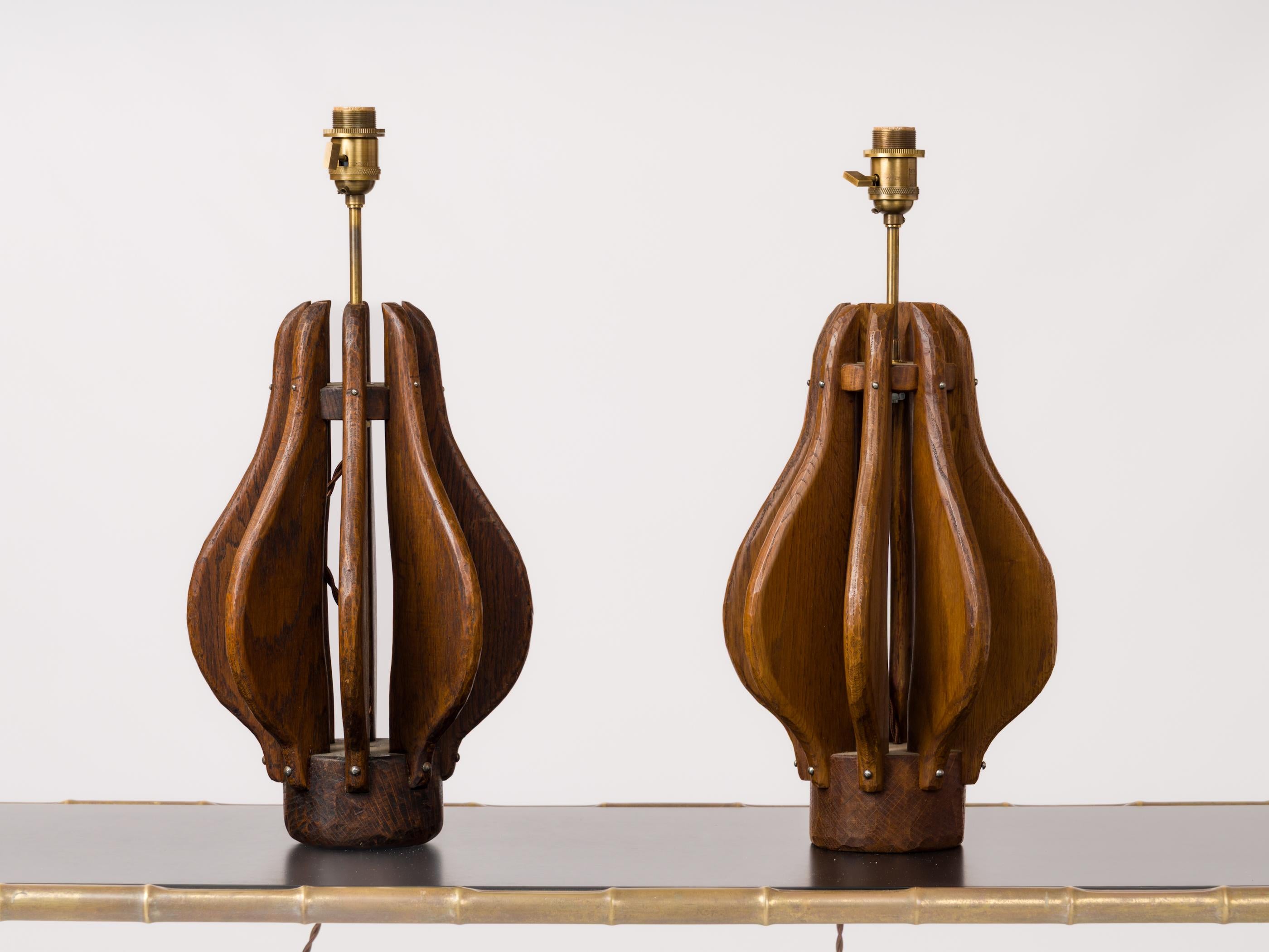 Pair of Brutalist lamps in stained oak. Structure not entirely identical, one being taller than the other. France 1970s.
These lamps have been rewired for use in the US.
Shades for showing purposes only.
These lamps will ship from France and can be
