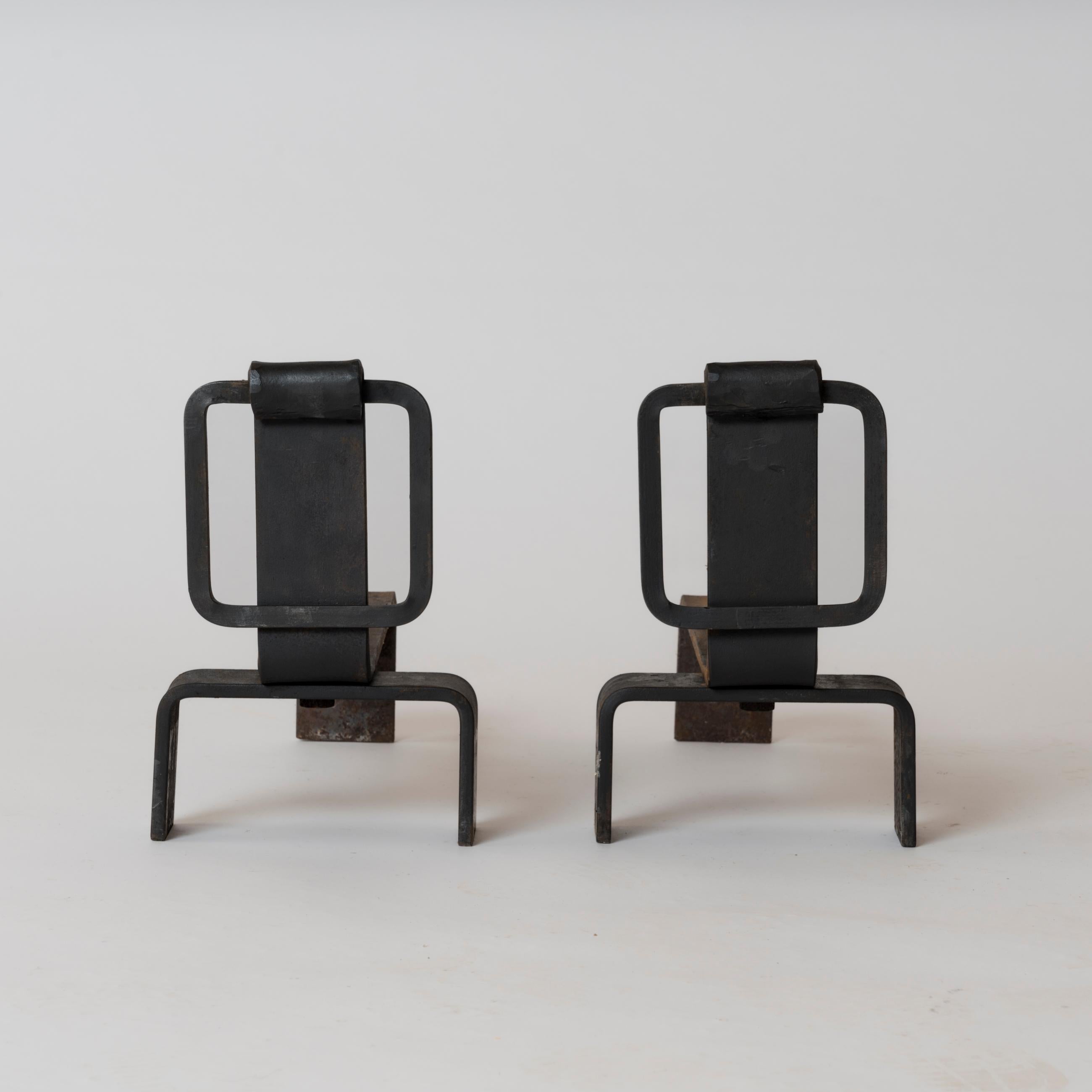 Pair of Brutalist, minimalist cast steel andirons with square motif buckle on the front side.
These andirons will ship from France and can be returned to either France or to a LIC NY location.