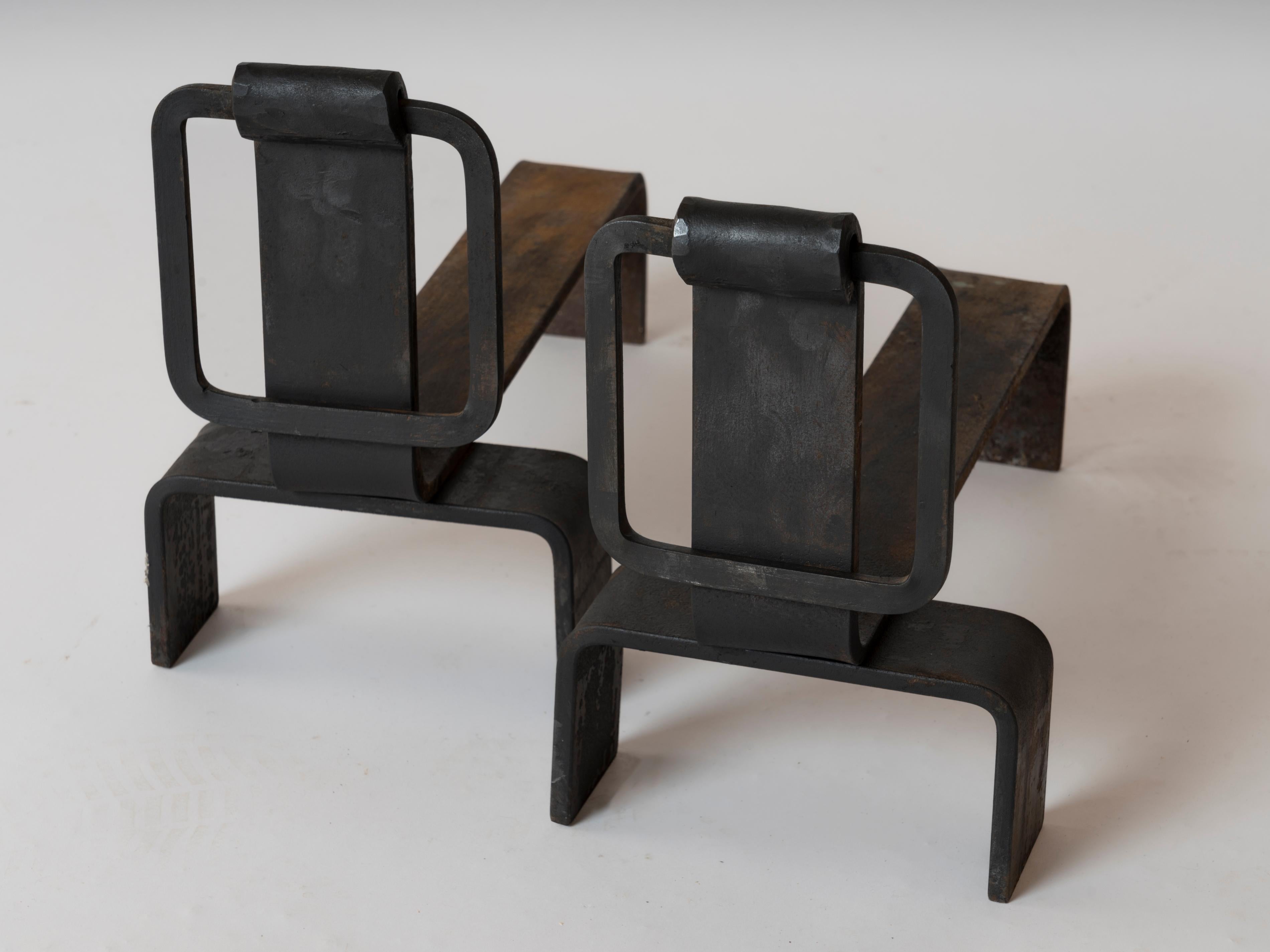 Pair of minimalist cast steel andirons whith square motif buckle on the fron side.
These andirons will ship from France and can be returned to either France or to a LIC NY location.
Price does not include shipping nor possible customs related