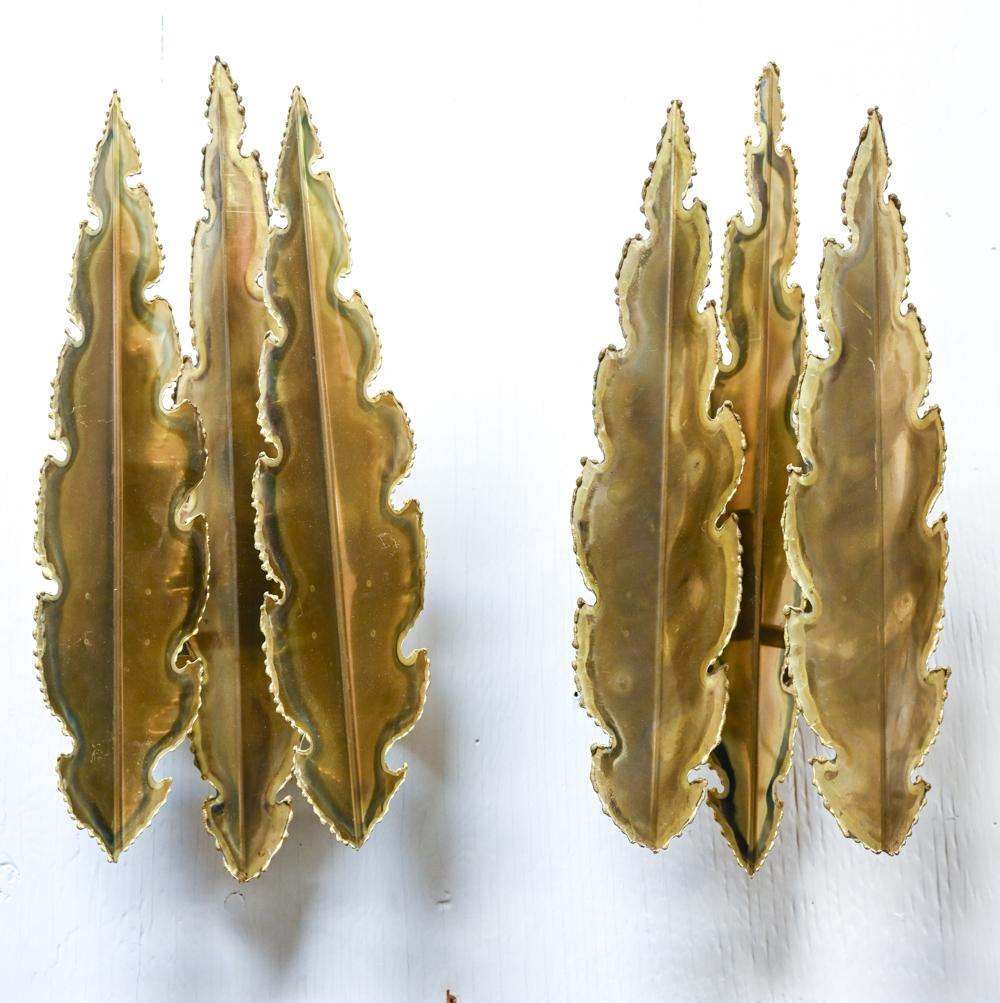 Exceptional pair of Brutalist leaf-form wall sconces in patinated torch-cut brass, designed by Sven Aage Holm Sørensen for Holm Sørensen and Pedersen, produced in the 1960's-1970's. Sconce marked on wall plate with Holm Sørensen & Pedersen Belysning