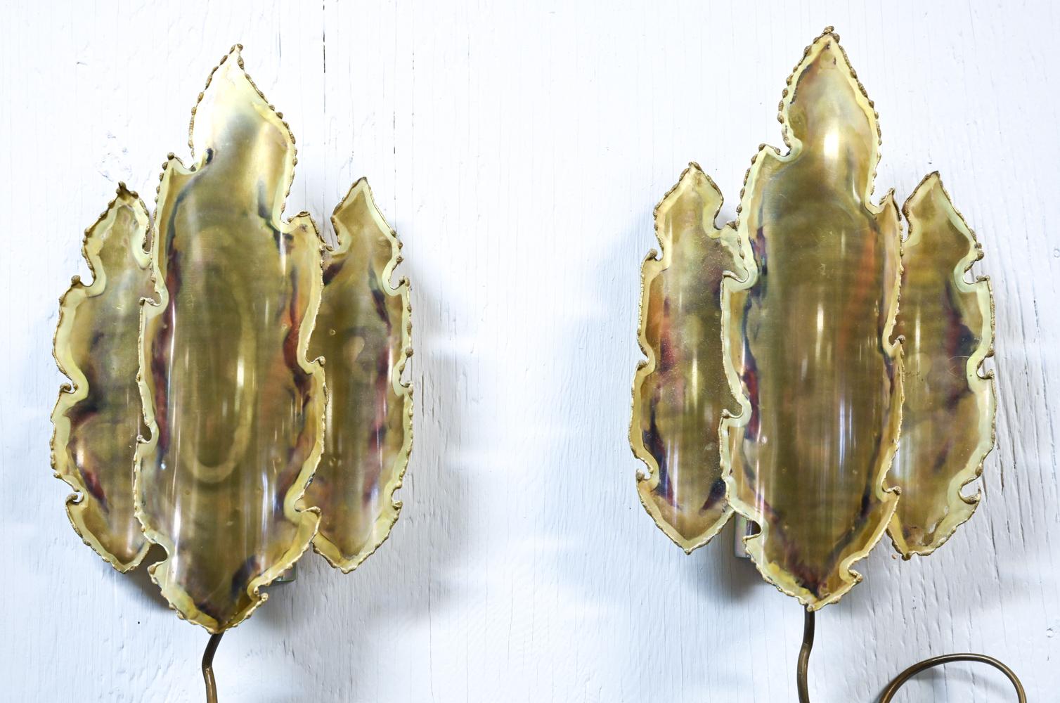 Exceptional pair of Brutalist leaf-form wall sconces in patinated torch-cut brass, designed by Sven Aage Holm Sørensen for Holm Sørensen and Pedersen, produced in the 1960's-1970's. Each sconce marked on wall plate with Holm Sørensen & Pedersen