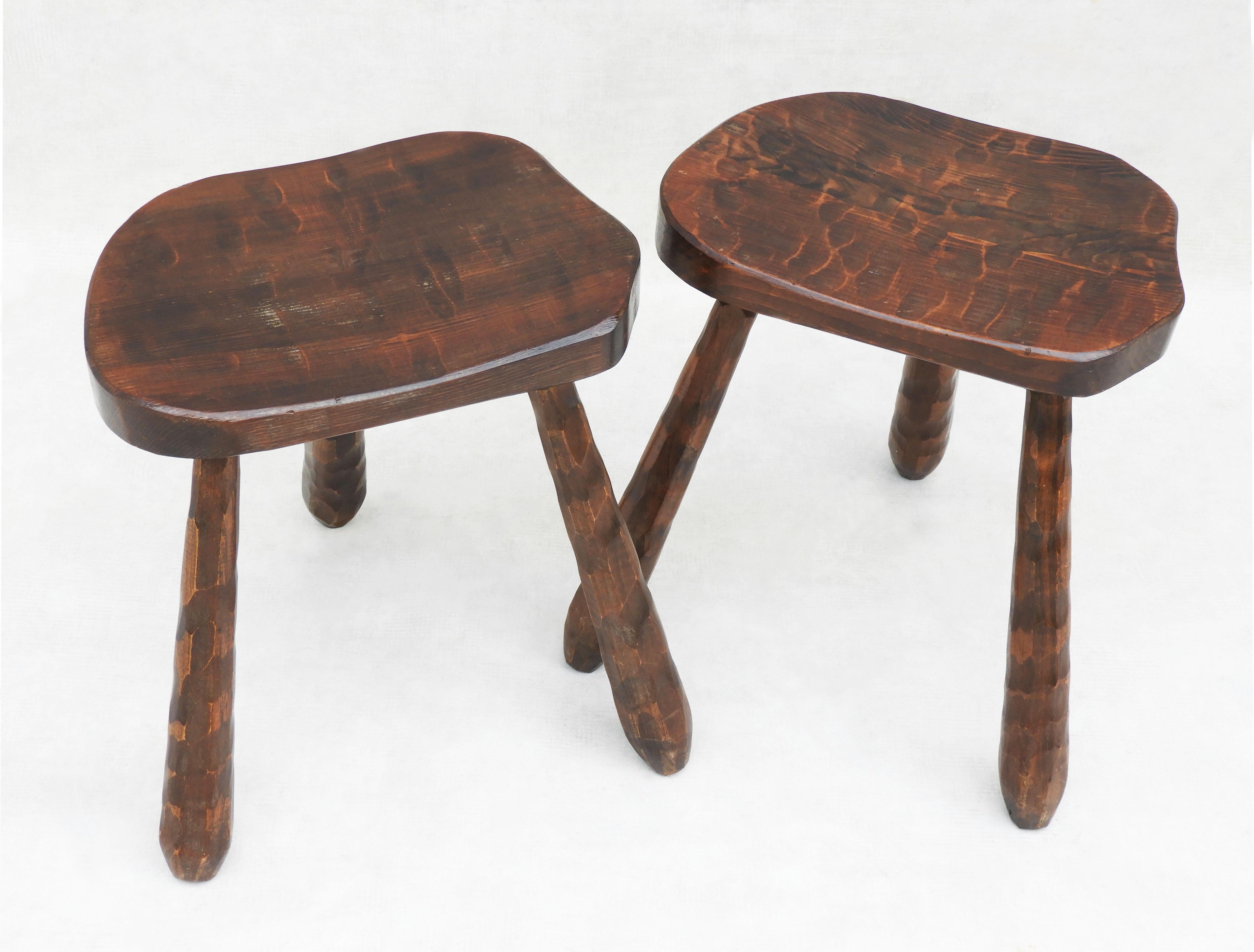 Pair of Brutalist tripod Stools C1950 attributed to Jean Touret/Atelier Marolles.  
A nice duo of handcrafted gouge-work stools with a beautiful primitive look. Well made, solid, and sound, with nice grain, good patina, and in great vintage