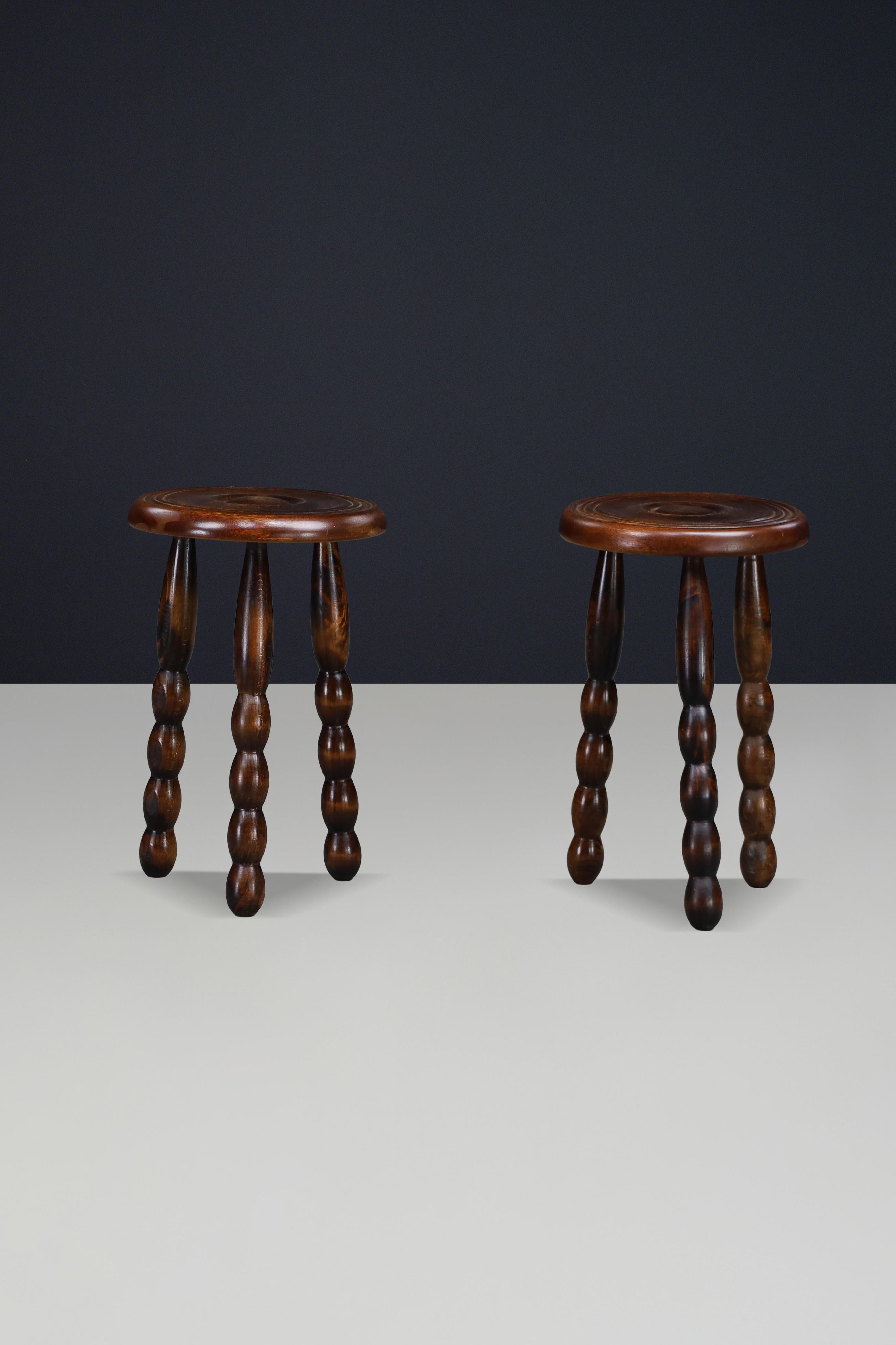 Pair of Brutalist Walnut Stools in the Manner of Charles Dudouyt, France, 1940s


A sculptural pair of French Brutalist stools crafted in solid walnut, designed in the manner of Charles Dudouyt, France, circa 1940s.

The stools feature thick
