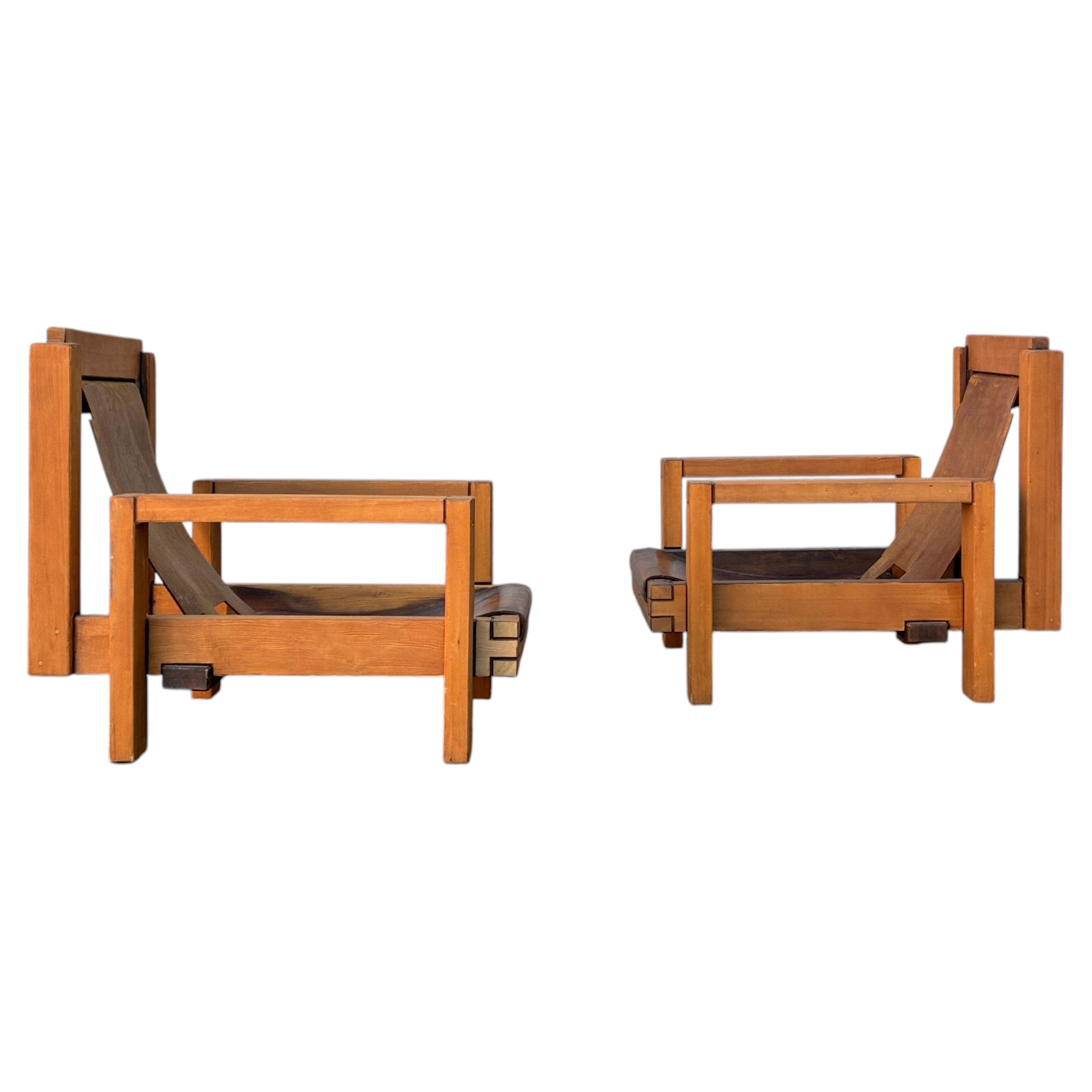 pair of brutalist wood and leather armchairs For Sale