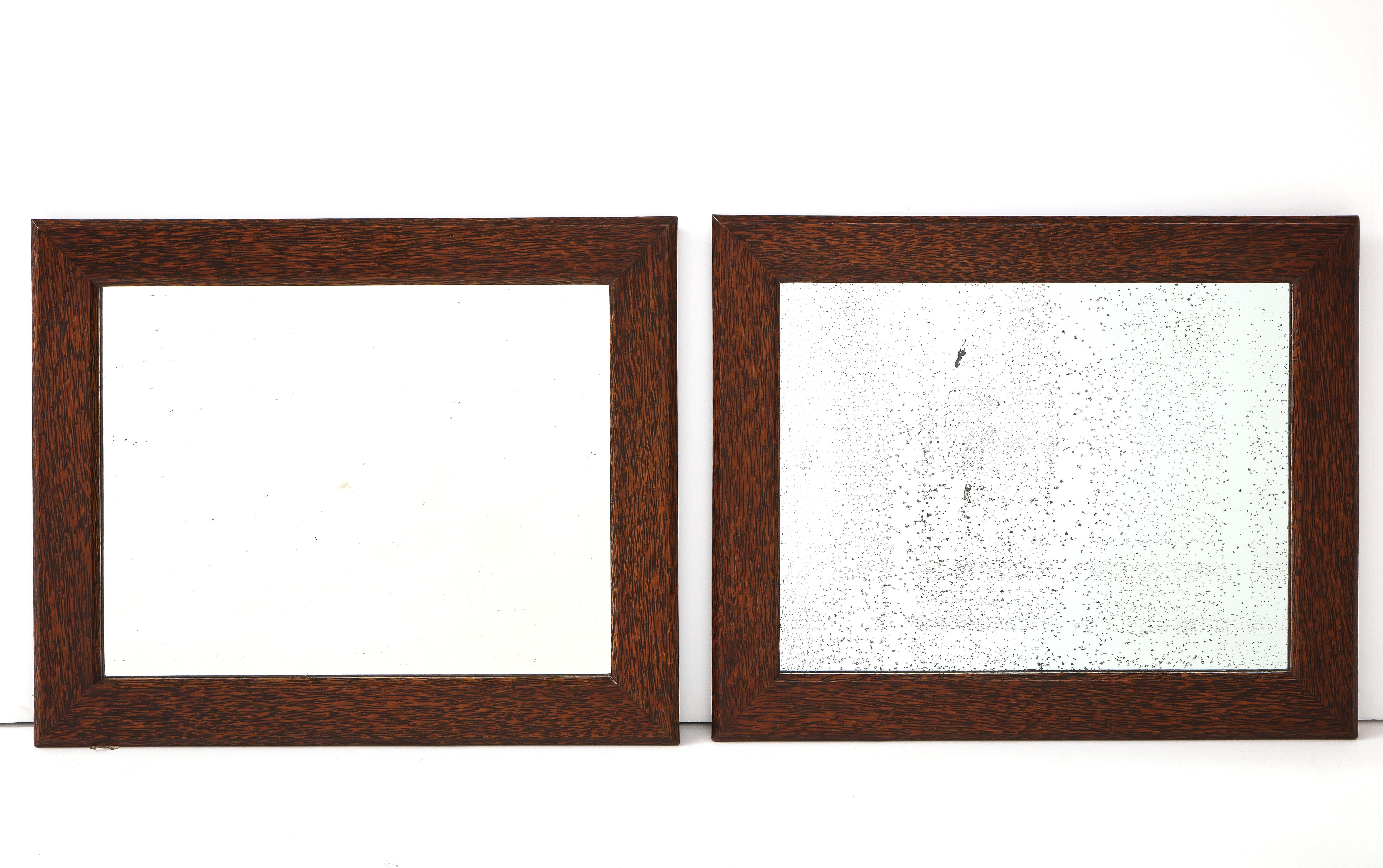 Pair of Bruxelles Art Deco mirrors, A. Leroy, Belgium, circa 1935-1940, labeled.
Palm wood, original plaquets on verso, original antique glass, second new glass, (both usable, we can make both new glass if desired)

Size: H 17.5, D 21 in. each.