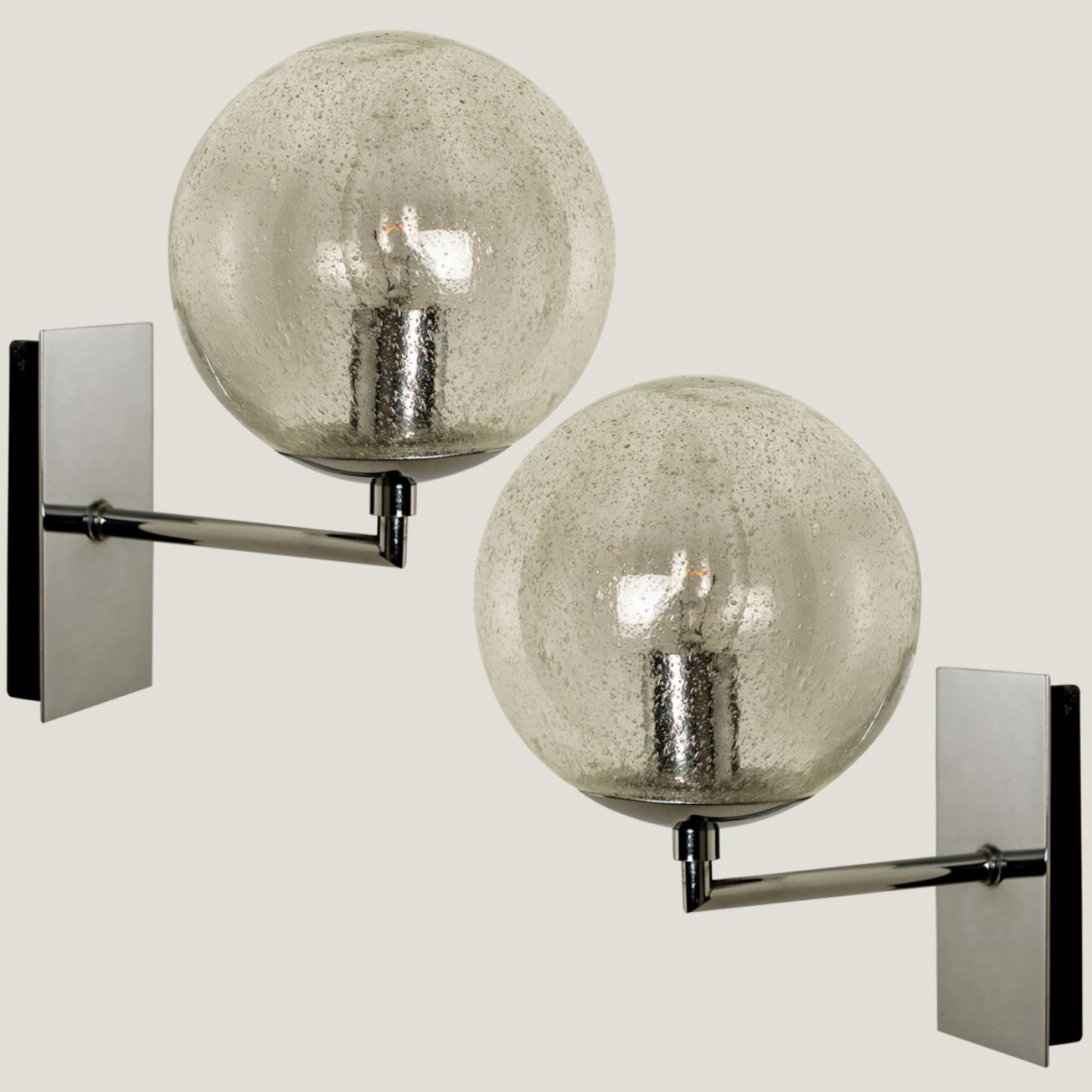 Wonderful high-end Doria wall lights. Manufactured in the 1960s in Germany, Europe by Doria Leuchten.
With a clear and blown glass bulb. The stylish elegance of this lamp suits many environments, from Mid century to Hollywood Regency, from Danish