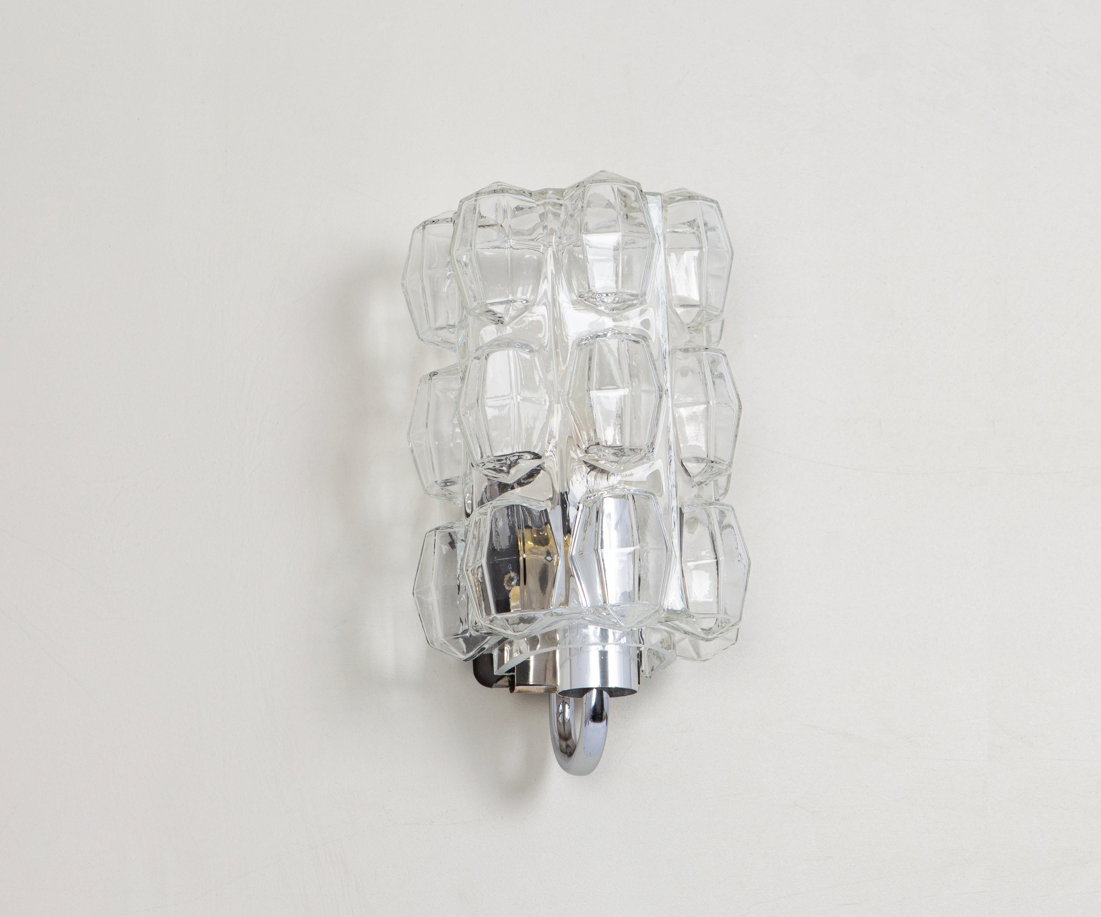 Wonderful pair of wall lights, from Limburg Glashütte, Germany, circa 1960-1970. Clear bubble glasses on a chrome and metal base.

For each sconce:

Heavy quality and in very good condition. Cleaned, well-wired and ready to use. The fixture requires