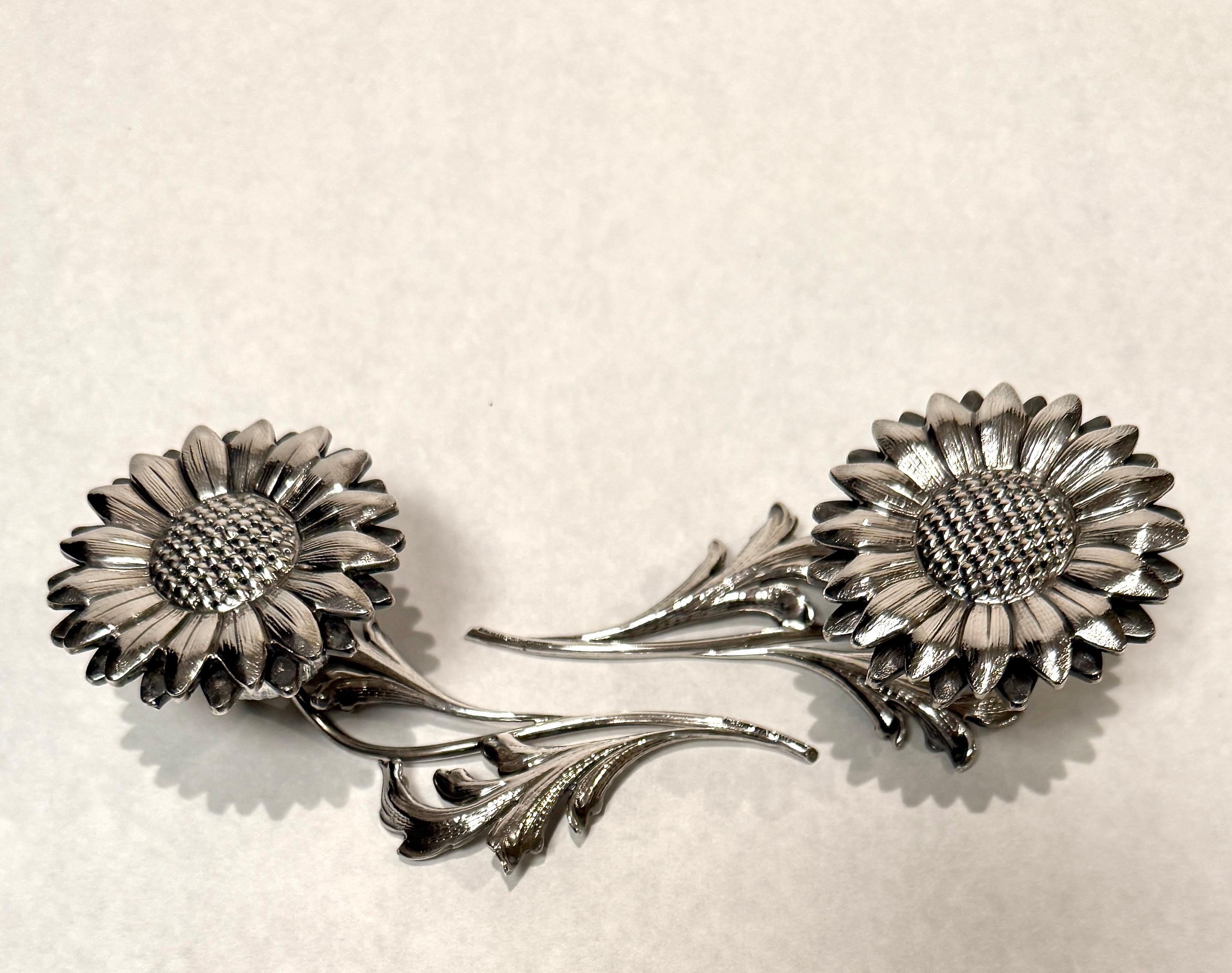 Buccellati sterling silver pomander, modelled as a sunflower on foliate stem,  Stamped 'Buccellati, Italy, Sterling. Of fine detail, with removable flower exposing a hollow bulb at the termination of the stem.
142g.