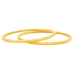 Pair of Bucherer Gold Cable Twist Bangles