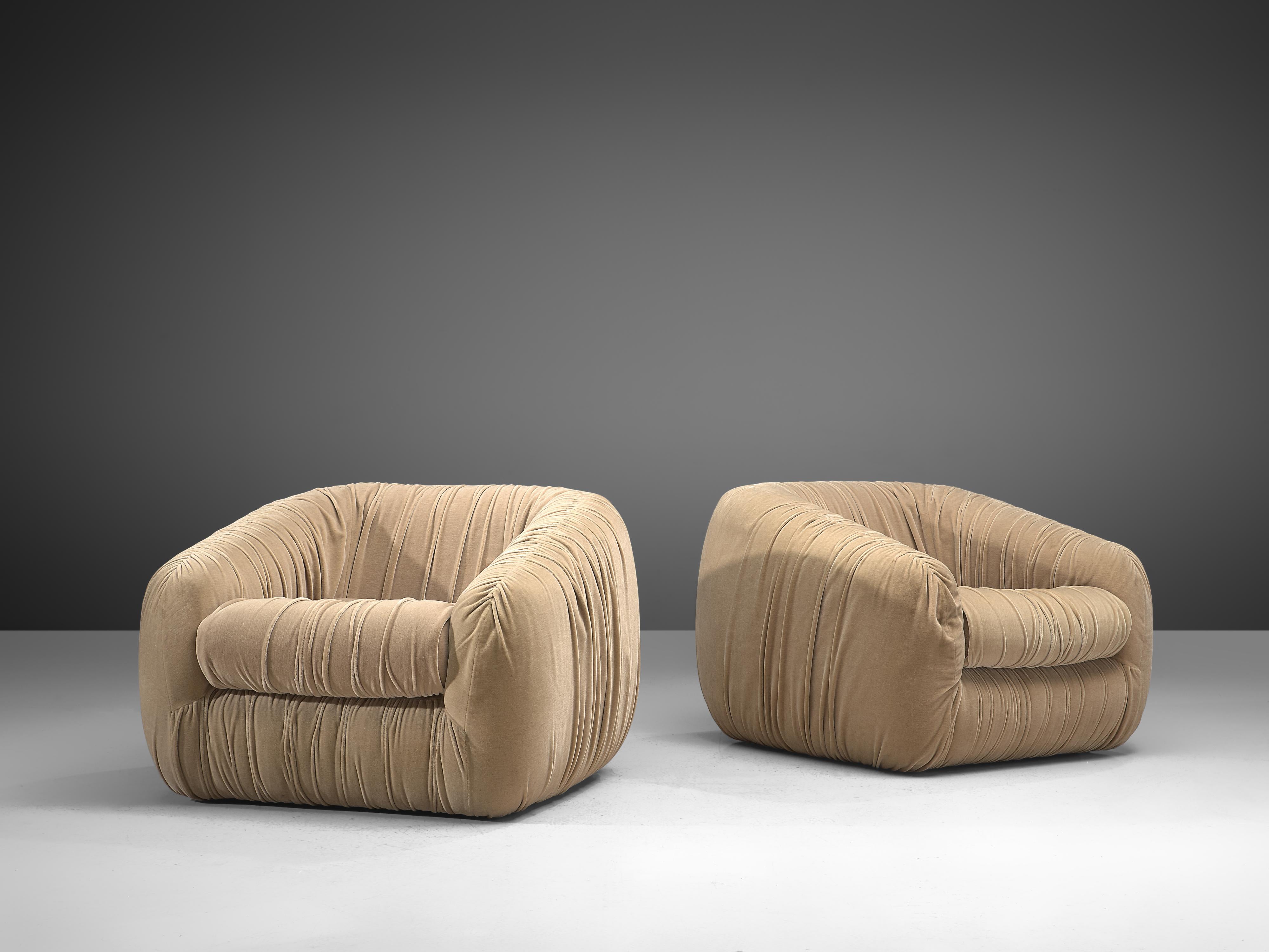 Airborne, pair of lounge chairs, beige velvet, France, 1970s

Stunning set of grand and bulky lounge chairs by Airborne. The chairs have an exaggerated plump appearance. Yet the thoughtful upholstery with arranged in elegant folds. The set is a