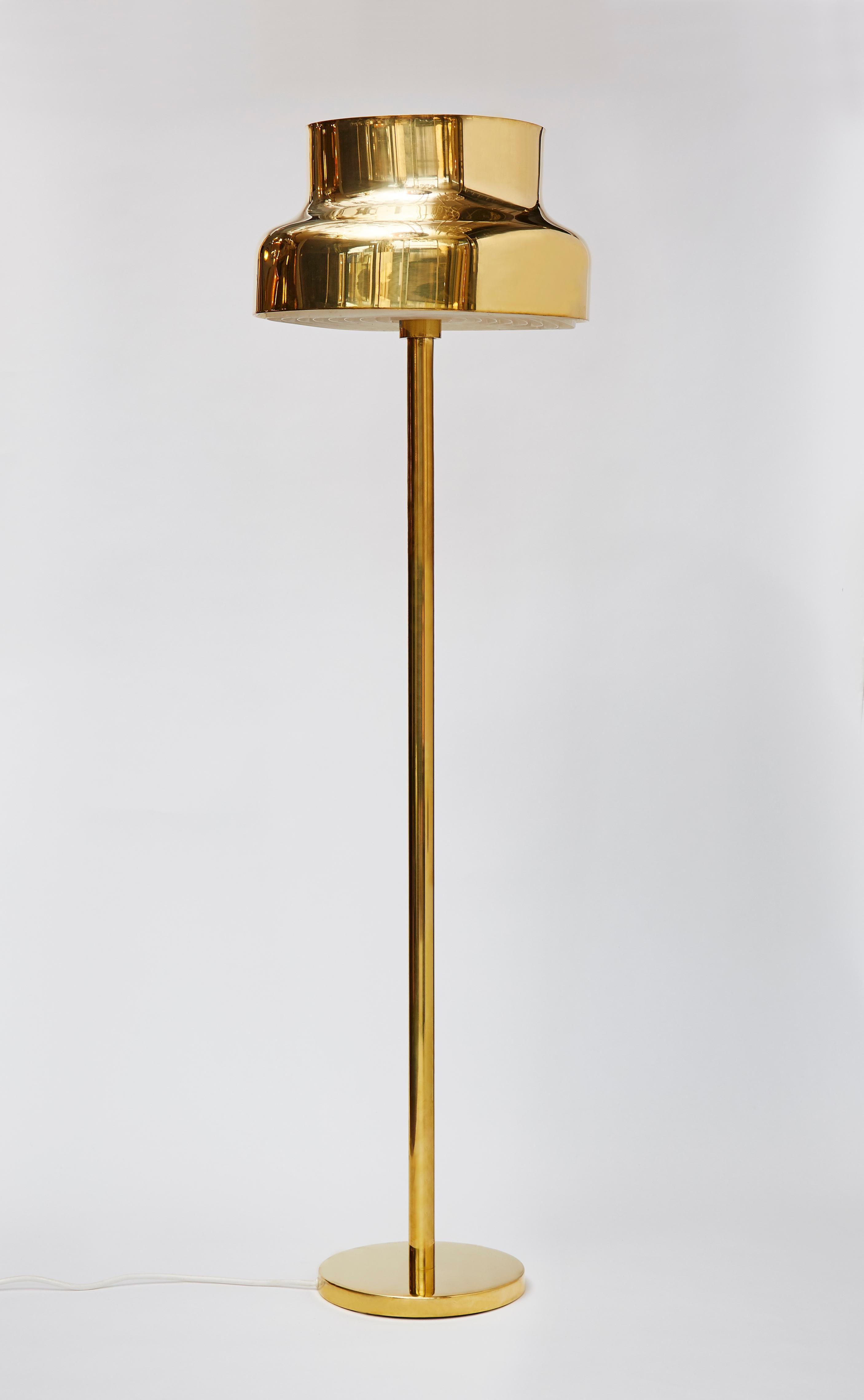 Pair of brass floor lamps by Anders Pehrson for Atelje Lyktan in 1968 named Bumling, boulder in Swedish.

       