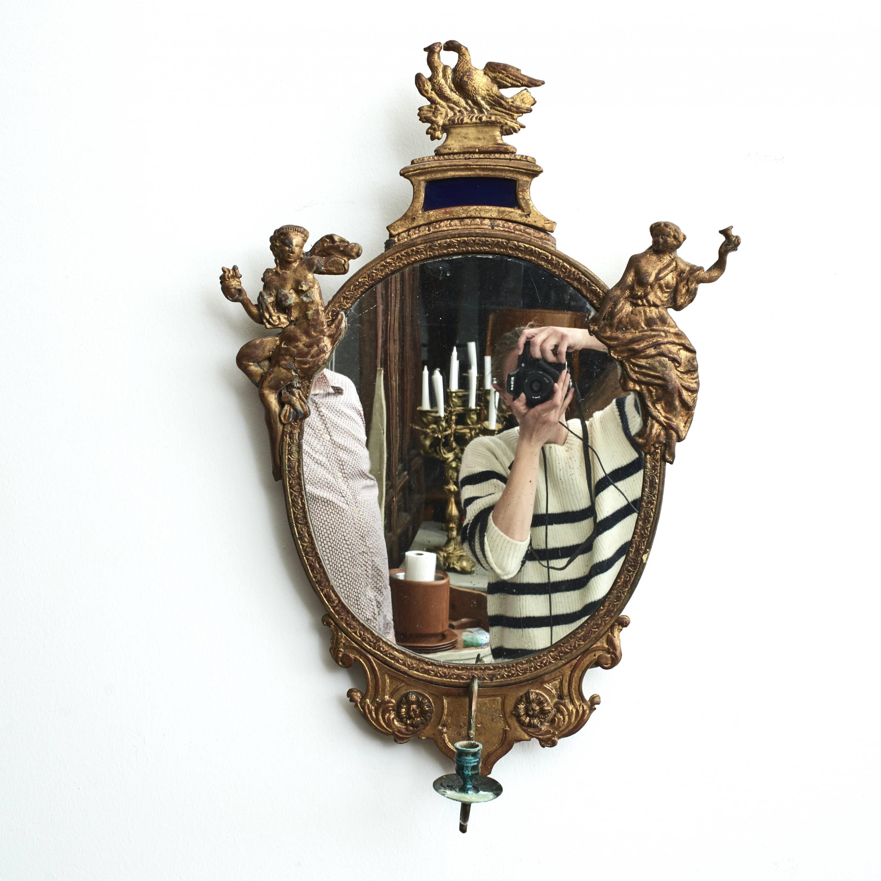 A rare pair of baroque wall mirror sconces by Burchard Precht ( 1651-1738 ).
Oval mirror frames flanked by allegorical female figures and birds in gilded lead. Under crown, depicting a bird, blue glass. Bronze sconce arms.

Untouched original