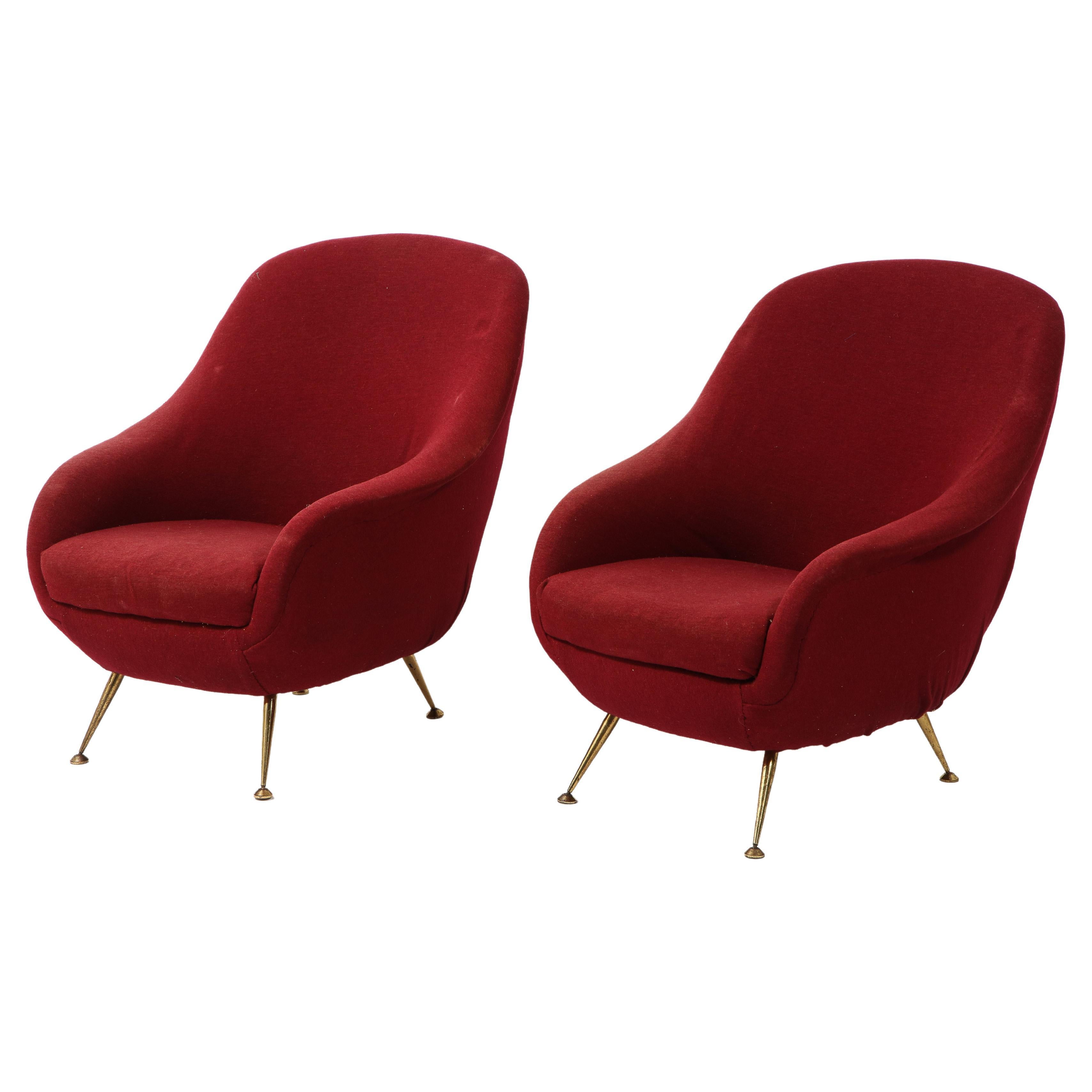 Elegant pair of burgundy velvet egg chairs on brass legs, the chairs will need re-upholstery.

          