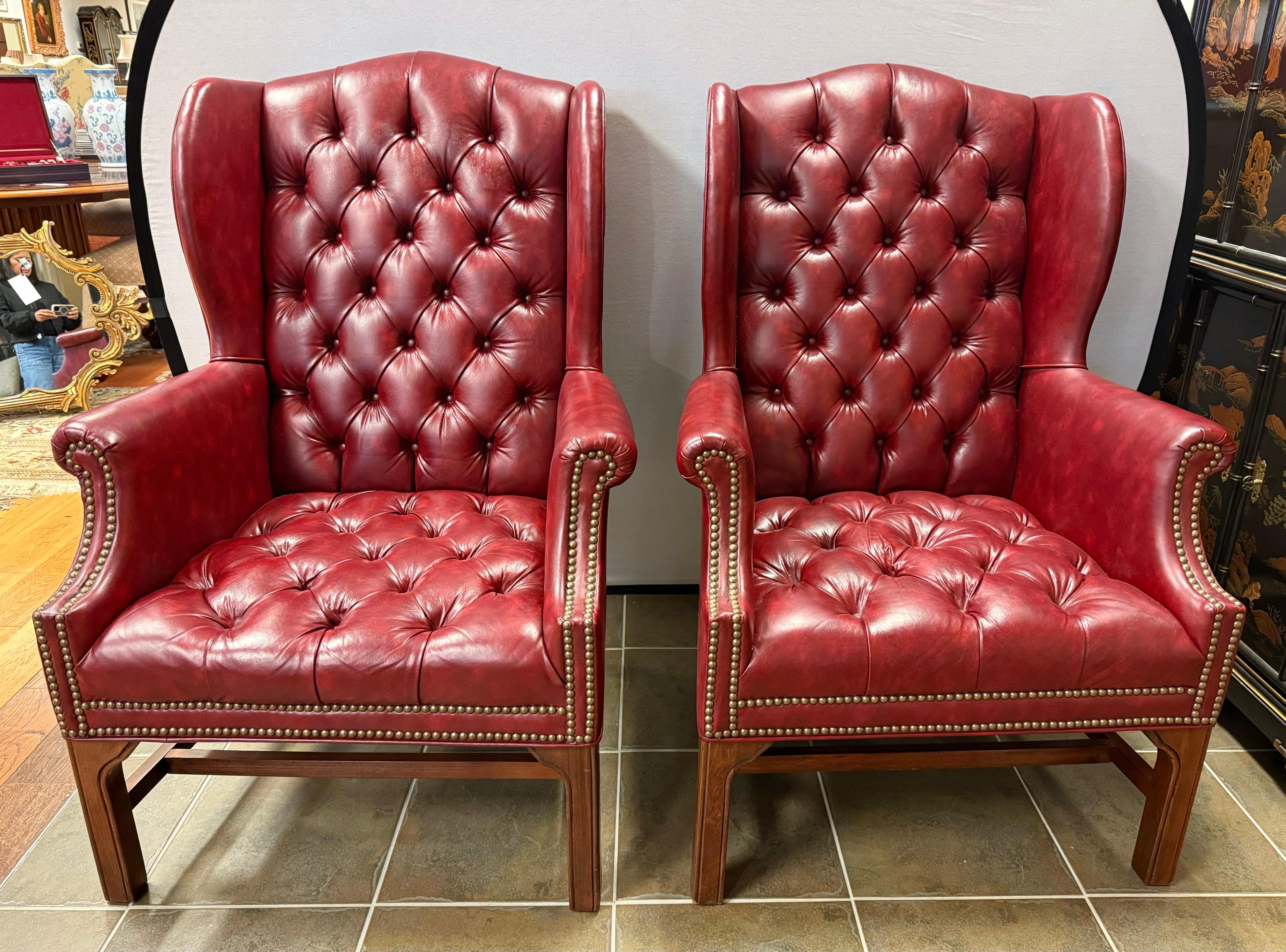 Stunning pair of Georgian style wingback tufted chesterfield chairs - perfect for your sitting room, office, library, bedroom and any luxurious living space.  Features mahogany stretchers and legs.  Sturdy, comfortable and soooo elegant to look at. 